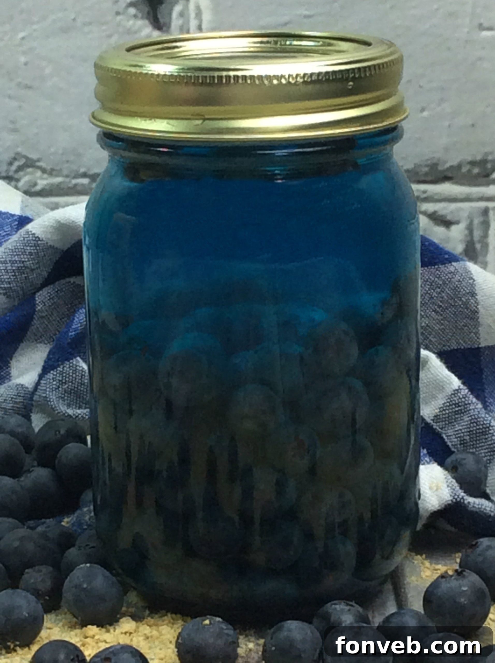 Assortment of homemade moonshine flavors, including a vibrant blue one