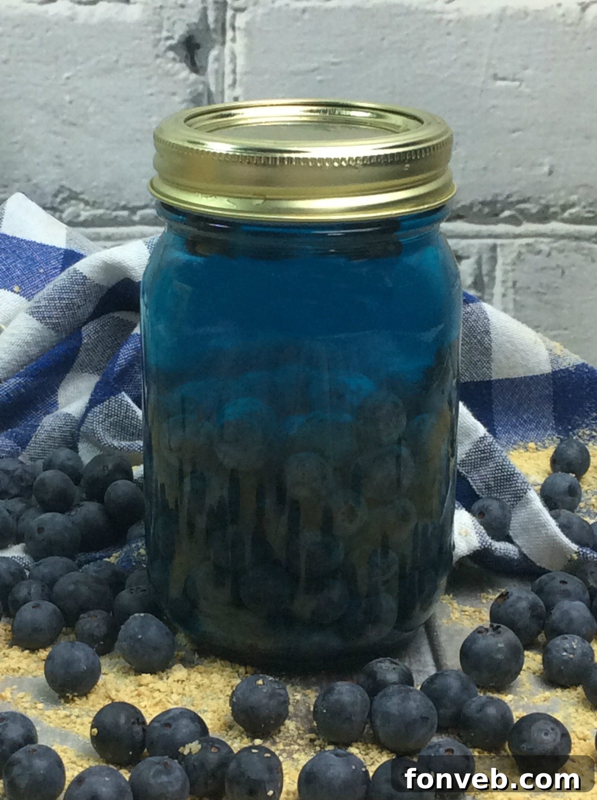 More jars of various fruit-infused moonshine, showcasing the diverse colors