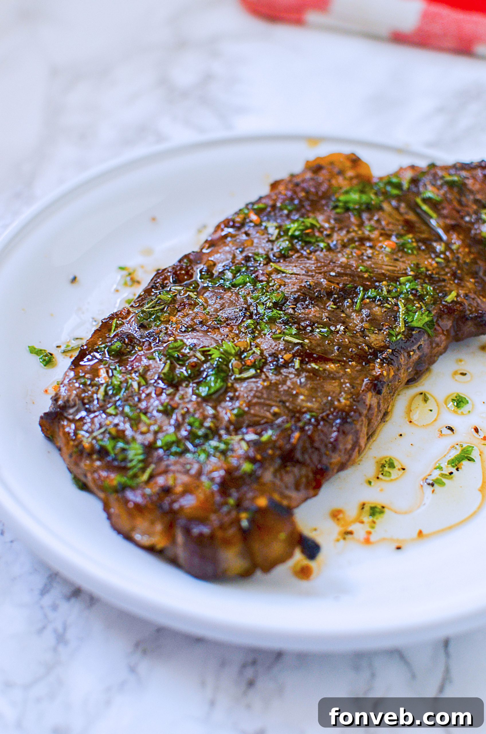 A perfectly cooked, rested steak on a cutting board, sliced to reveal its medium-rare interior and juicy texture.