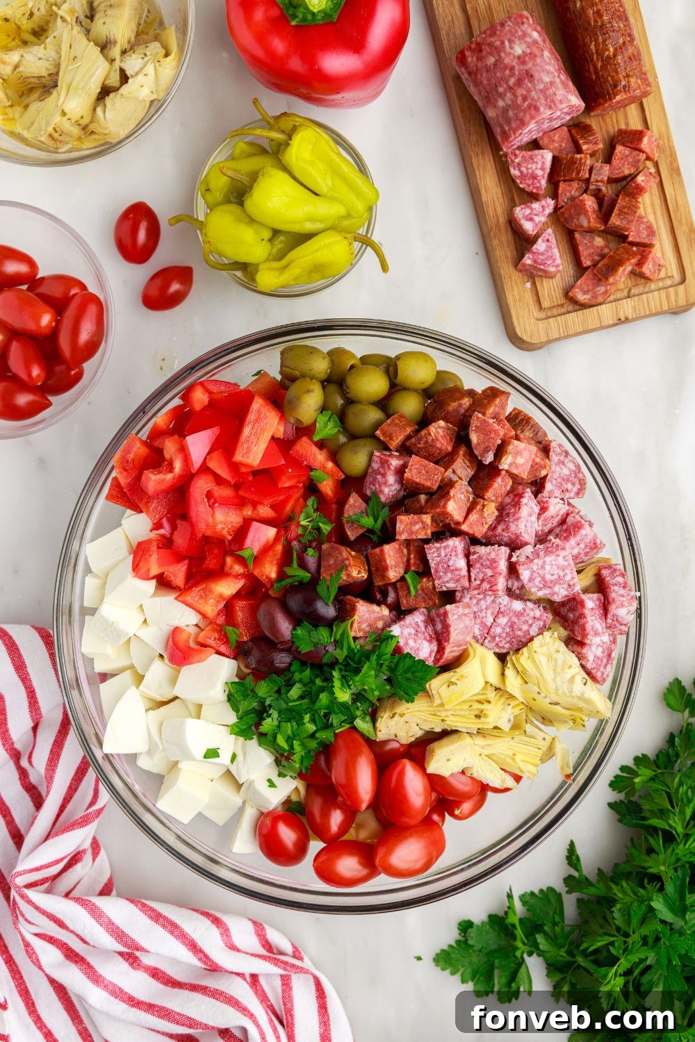 Antipasto Tortellini Pasta Salad all piled into a glass bowl 
