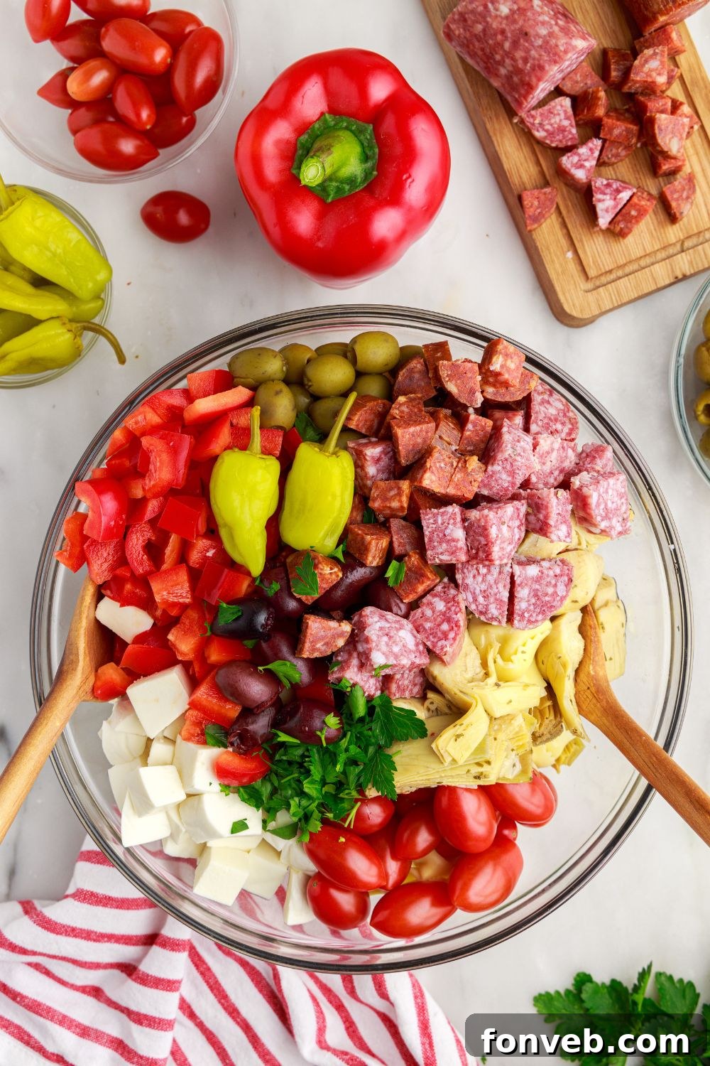 mixing bowl of Antipasto Tortellini Pasta Salad in a glass bowl 