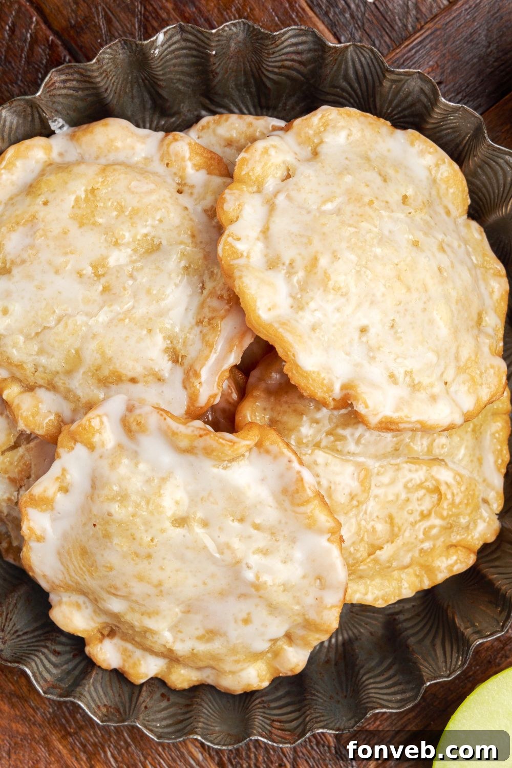 Golden Glazed Apple Hand Pies 17 close up of Deep Fried Apple Hand Pies on a plate on table