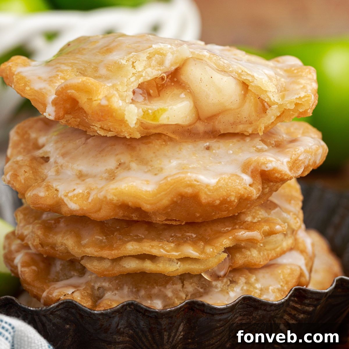 Golden Glazed Apple Hand Pies 3 stack of Deep Fried Apple Hand Pies on table