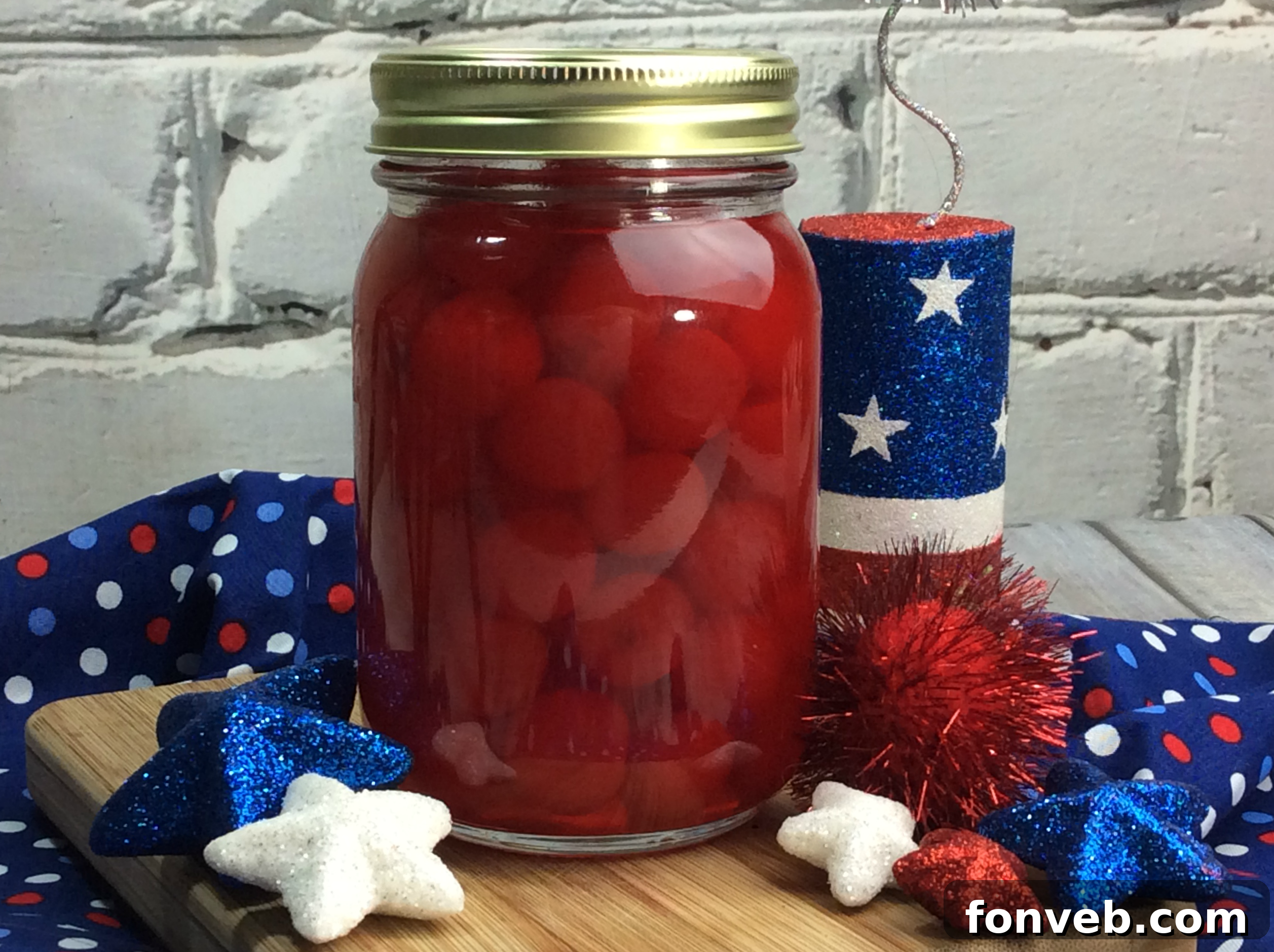 Various jars of cherry moonshine lined up, showcasing different stages or batches of the homemade spirit.
