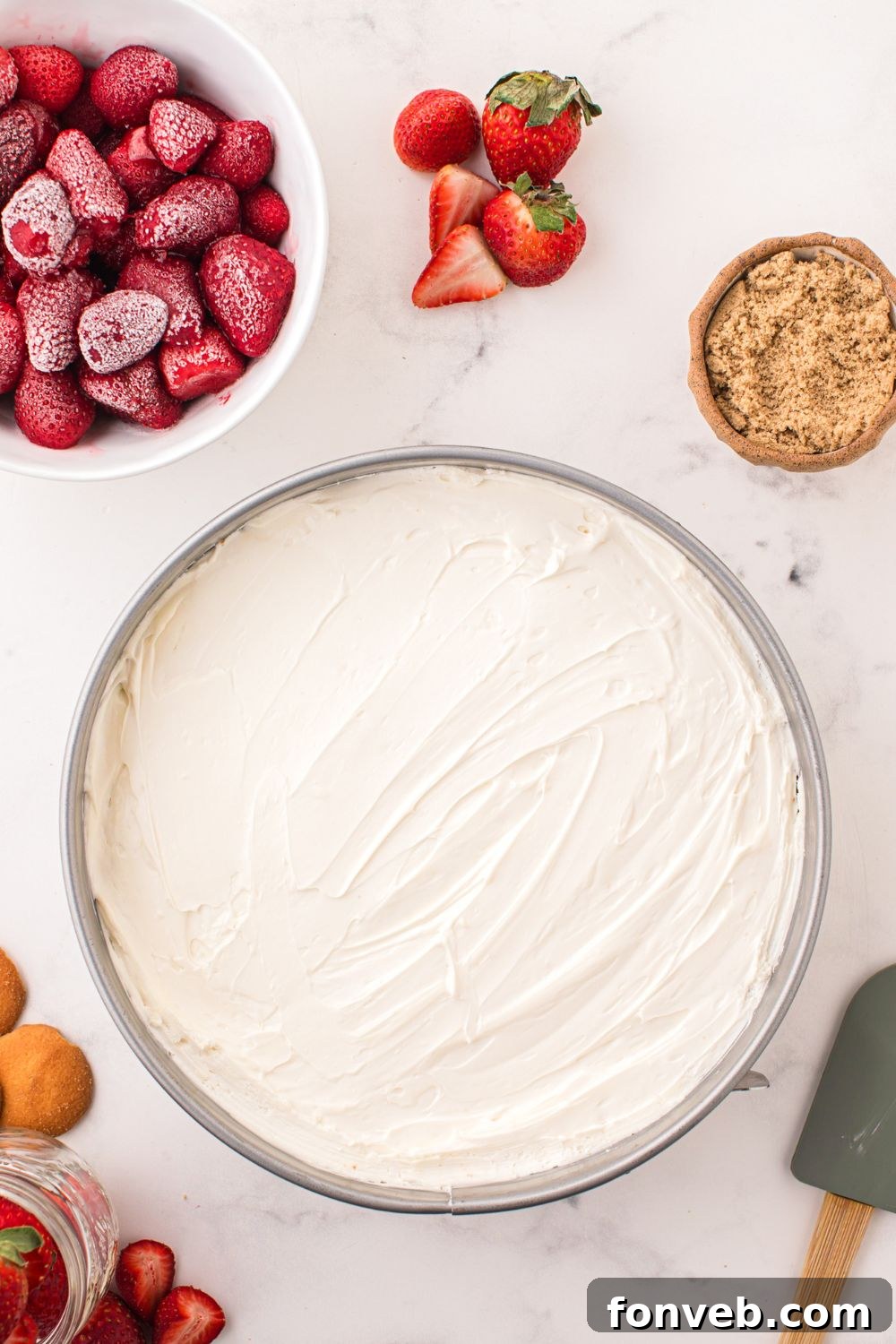 No Bake Cheesecake spread out in a pan on table 