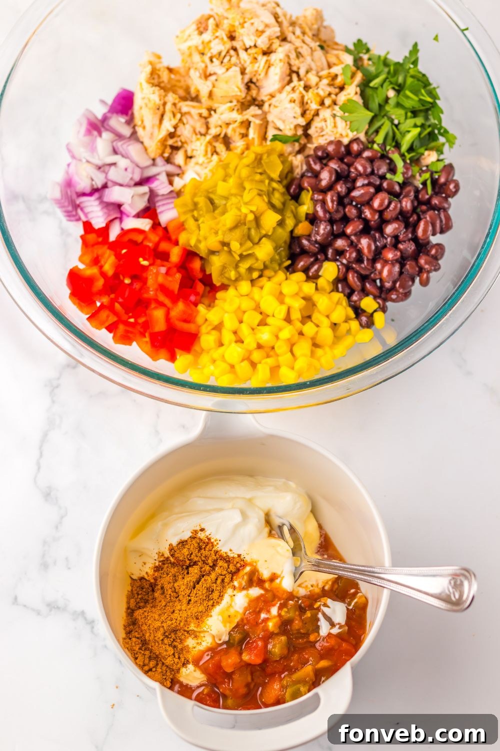 Creamy Taco Chicken Salad  ingredients in a bowl and the dressing in another small bowl 