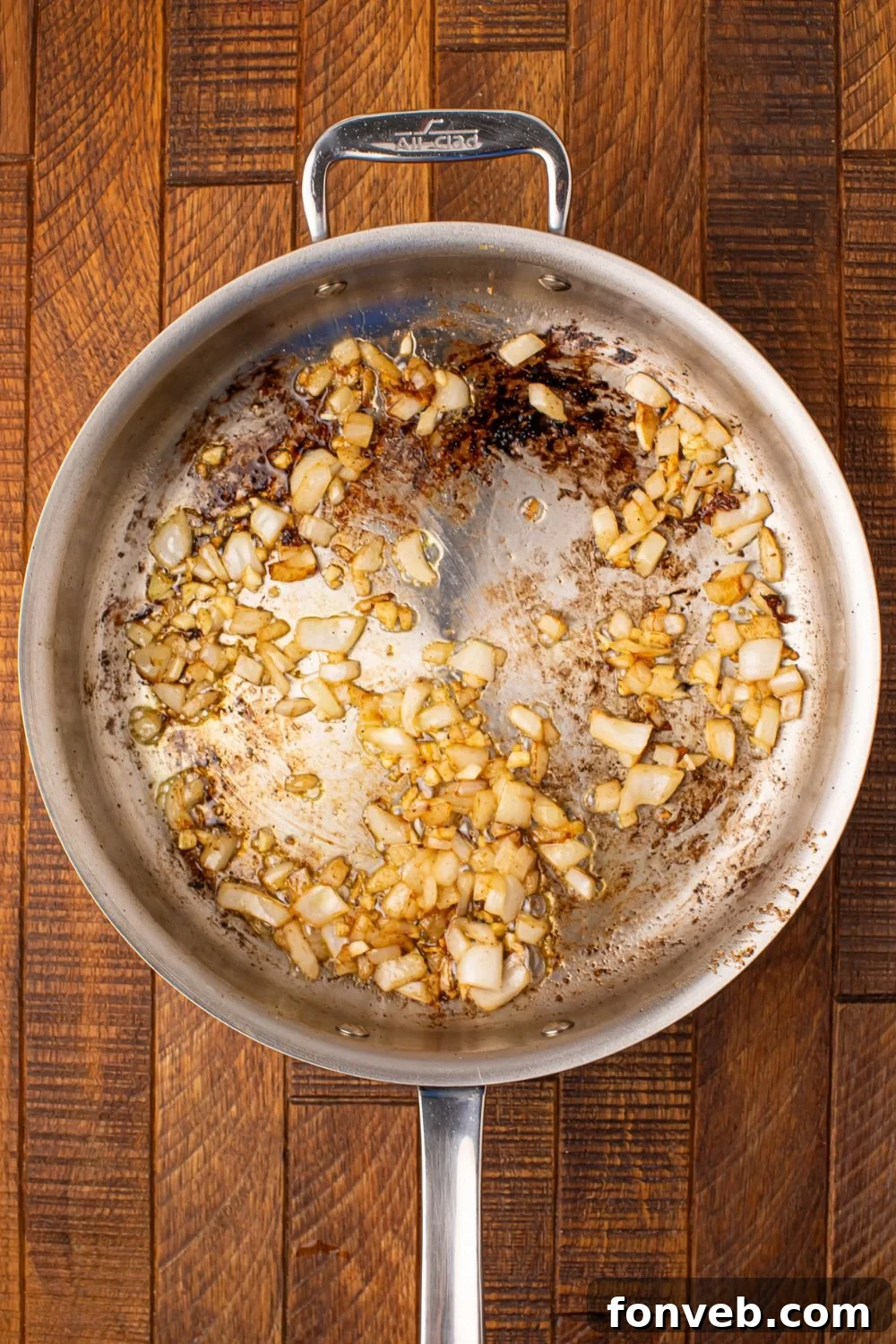 Keto Creamy Garlic Parmesan Cabbage Skillet 9 Sautéed onions in a skillet
