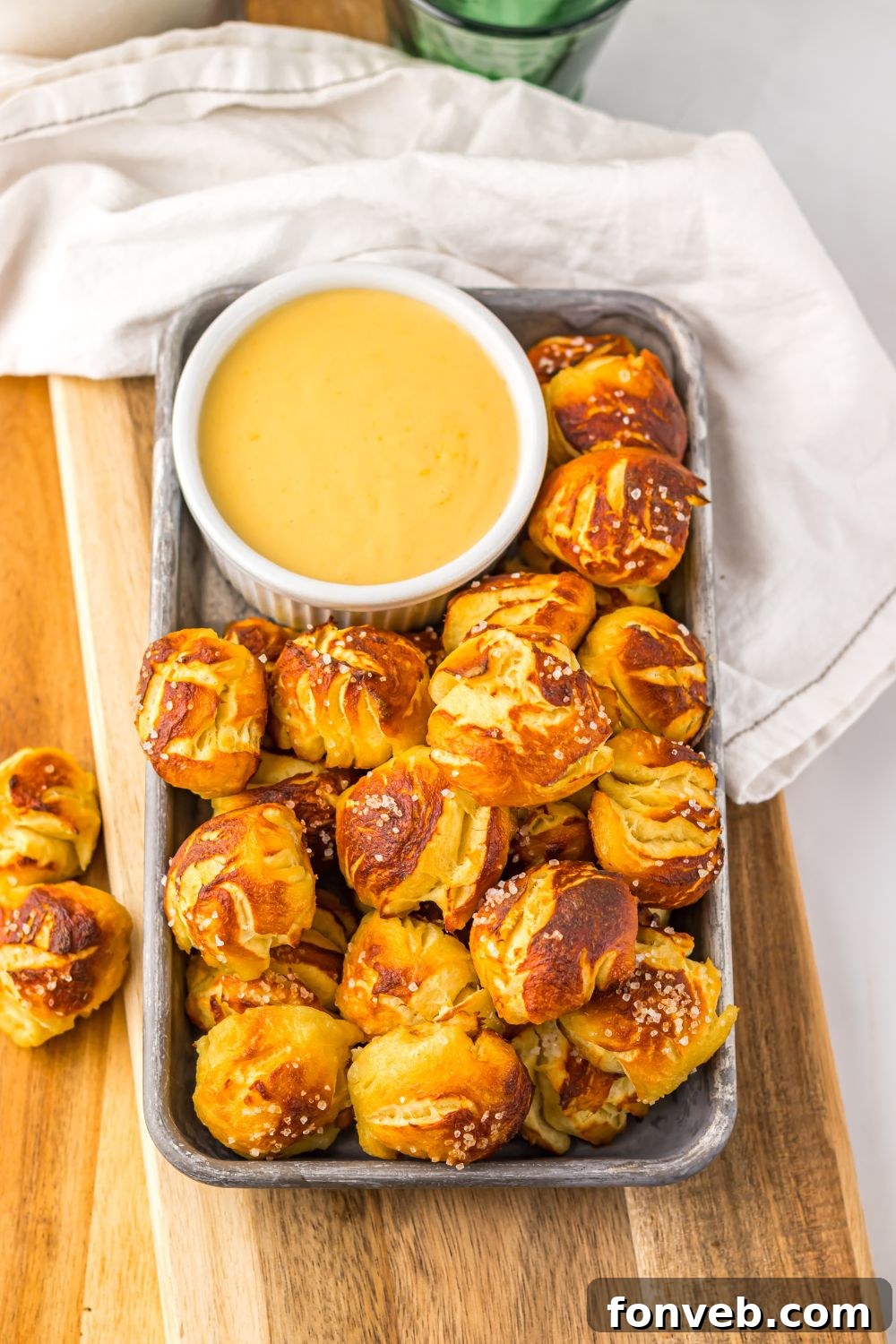 overhead look of Game day pretzel bites with cheese in a container