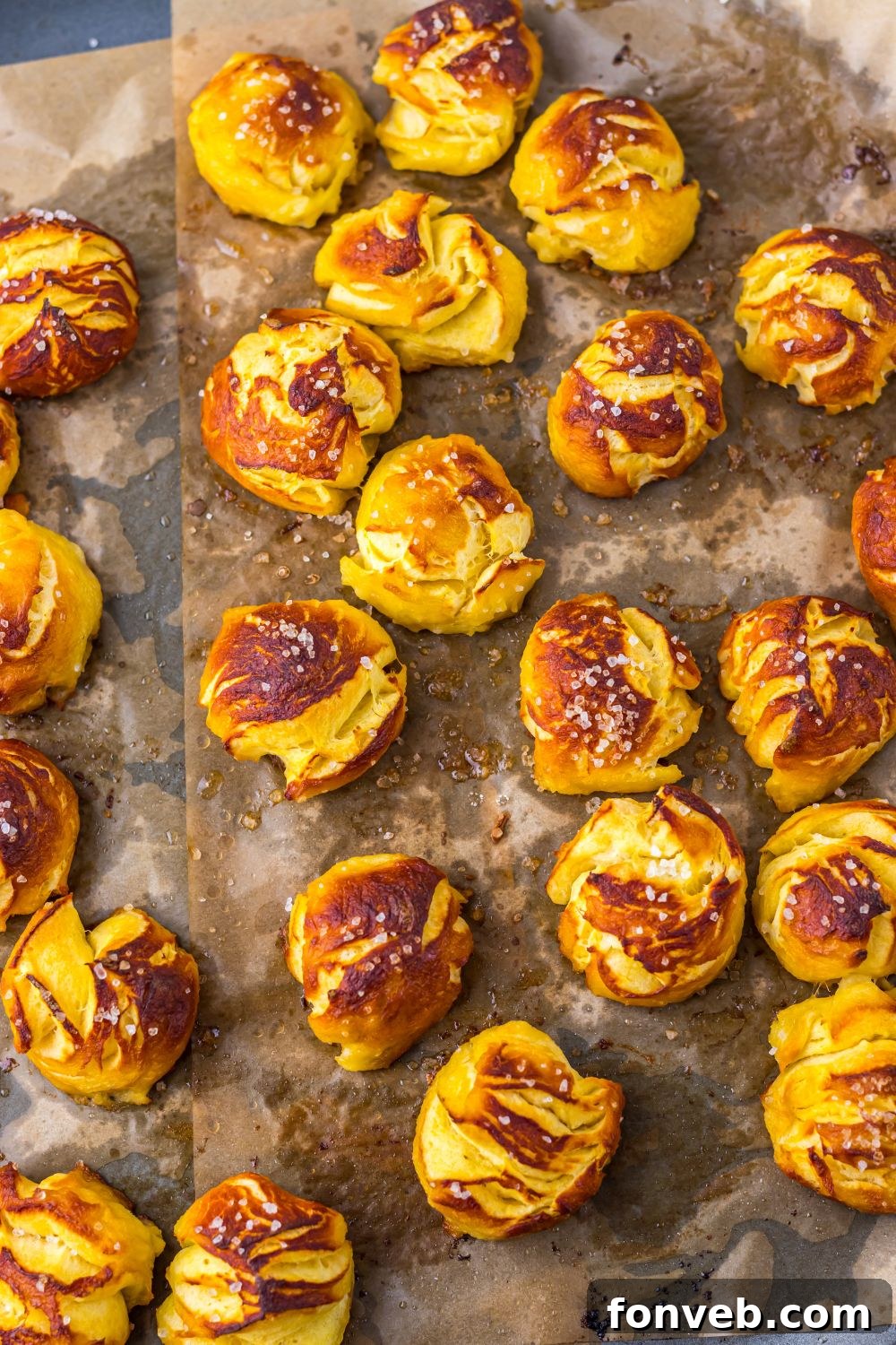 Easy Biscuit Pretzel Bites spread out on a baking sheet 