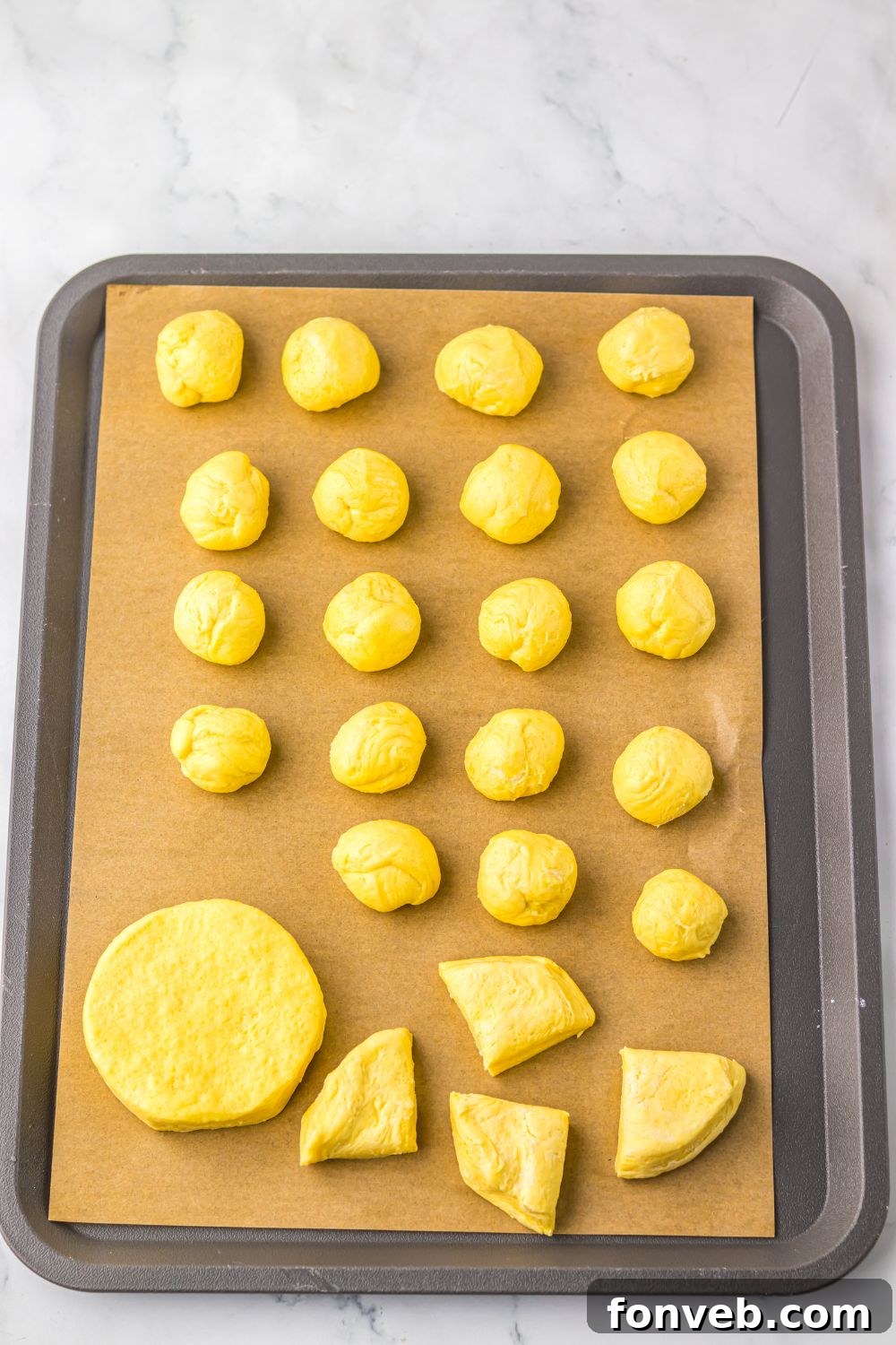 biscuit dough cut into pieces and rolled into balls