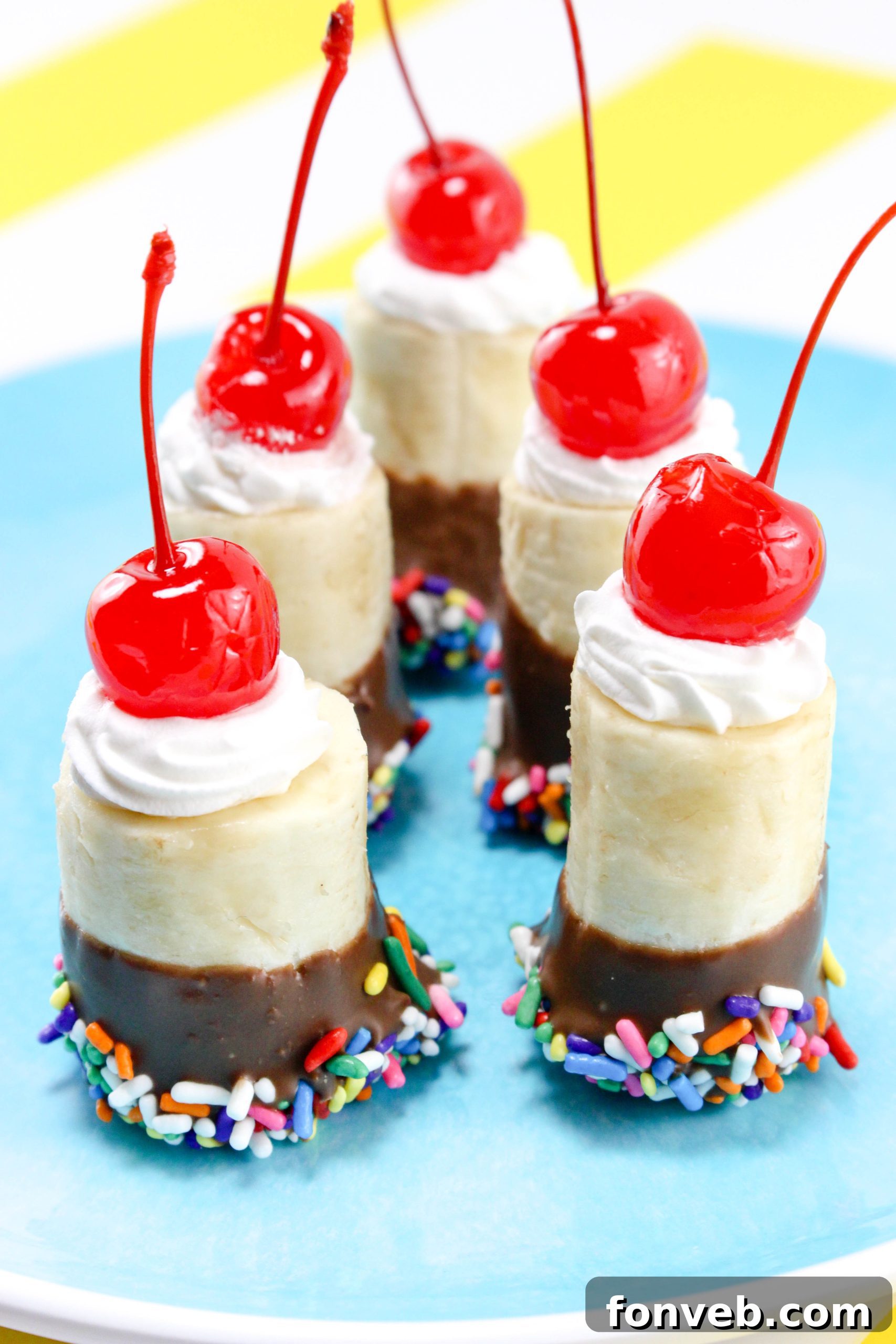 Banana Split Delights 7 A large platter of colorful banana split bites, ready to be served at a party or social gathering.