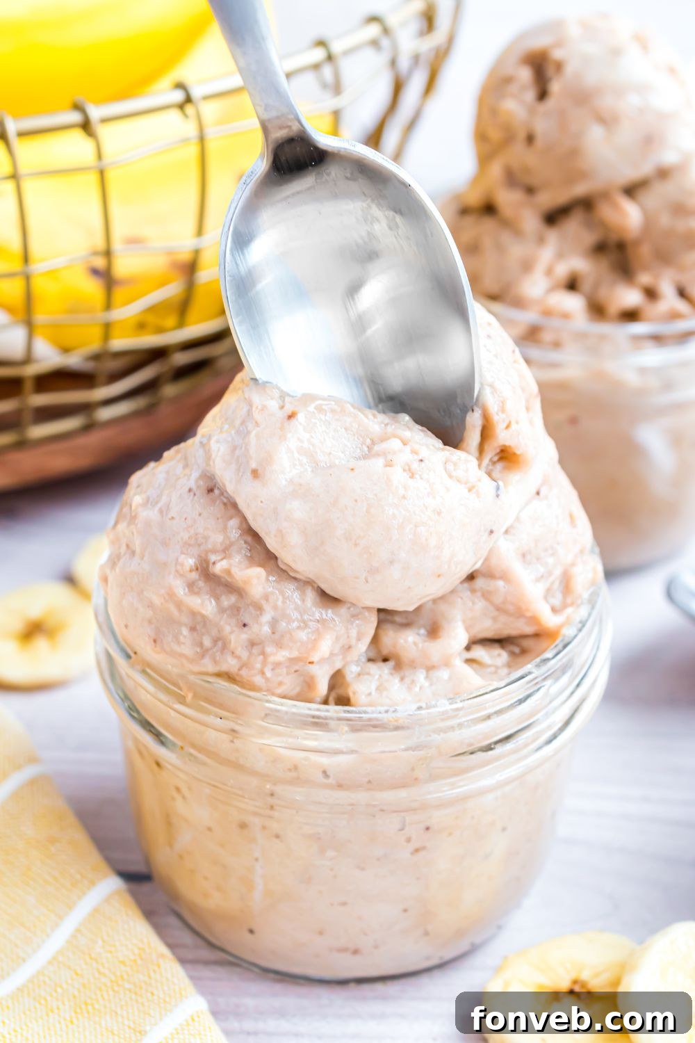 Banana Ice Cream: The One-Ingredient Wonder 17 glass bowl with Banana Ice Cream in it and a spoon poking inside