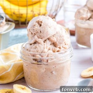 Banana Ice Cream: The One-Ingredient Wonder 26 Banana Ice Cream in a glass bowl on table with slices of bananas around table