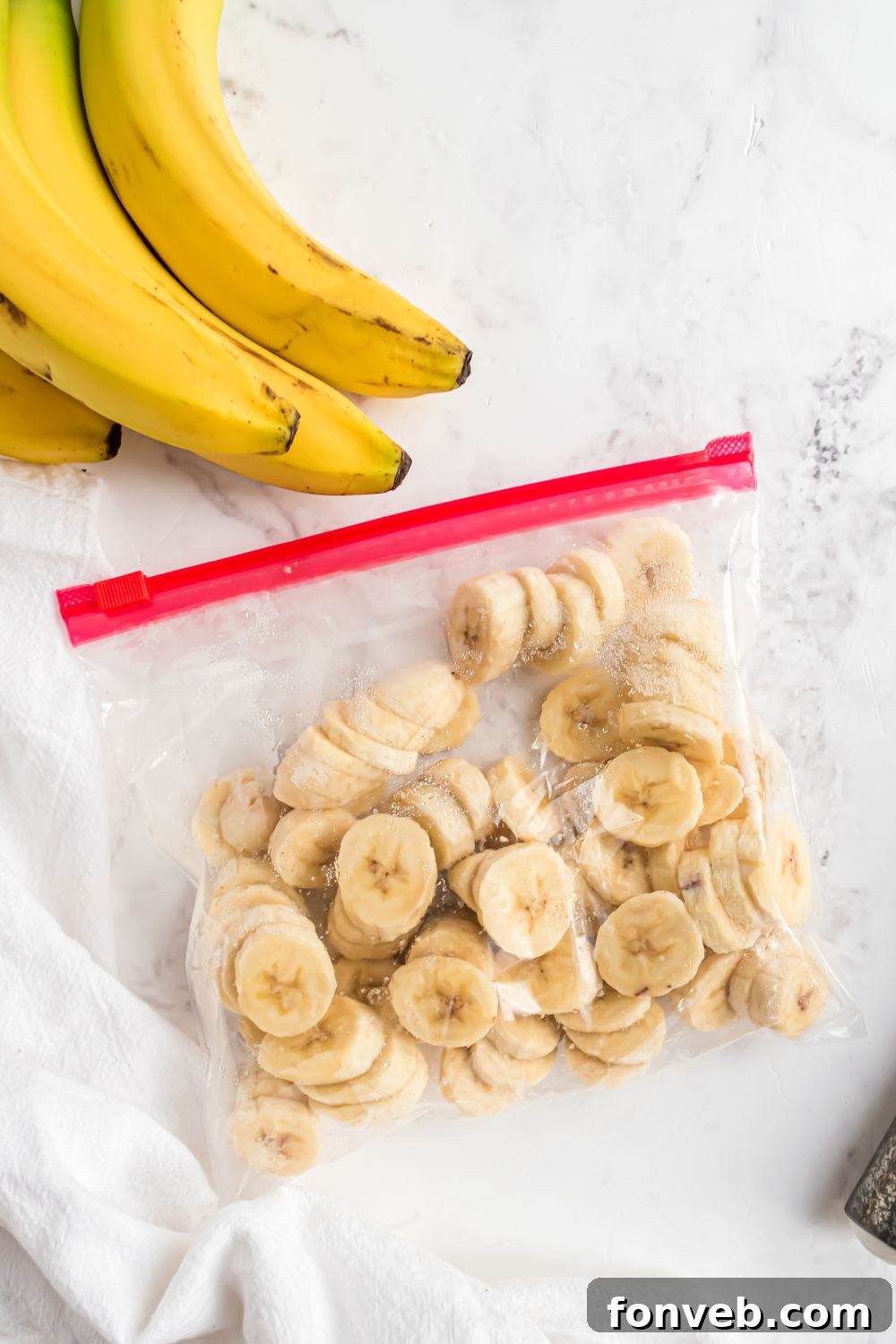 Banana Ice Cream: The One-Ingredient Wonder 7 frozen bananas in a ziploc bag on table