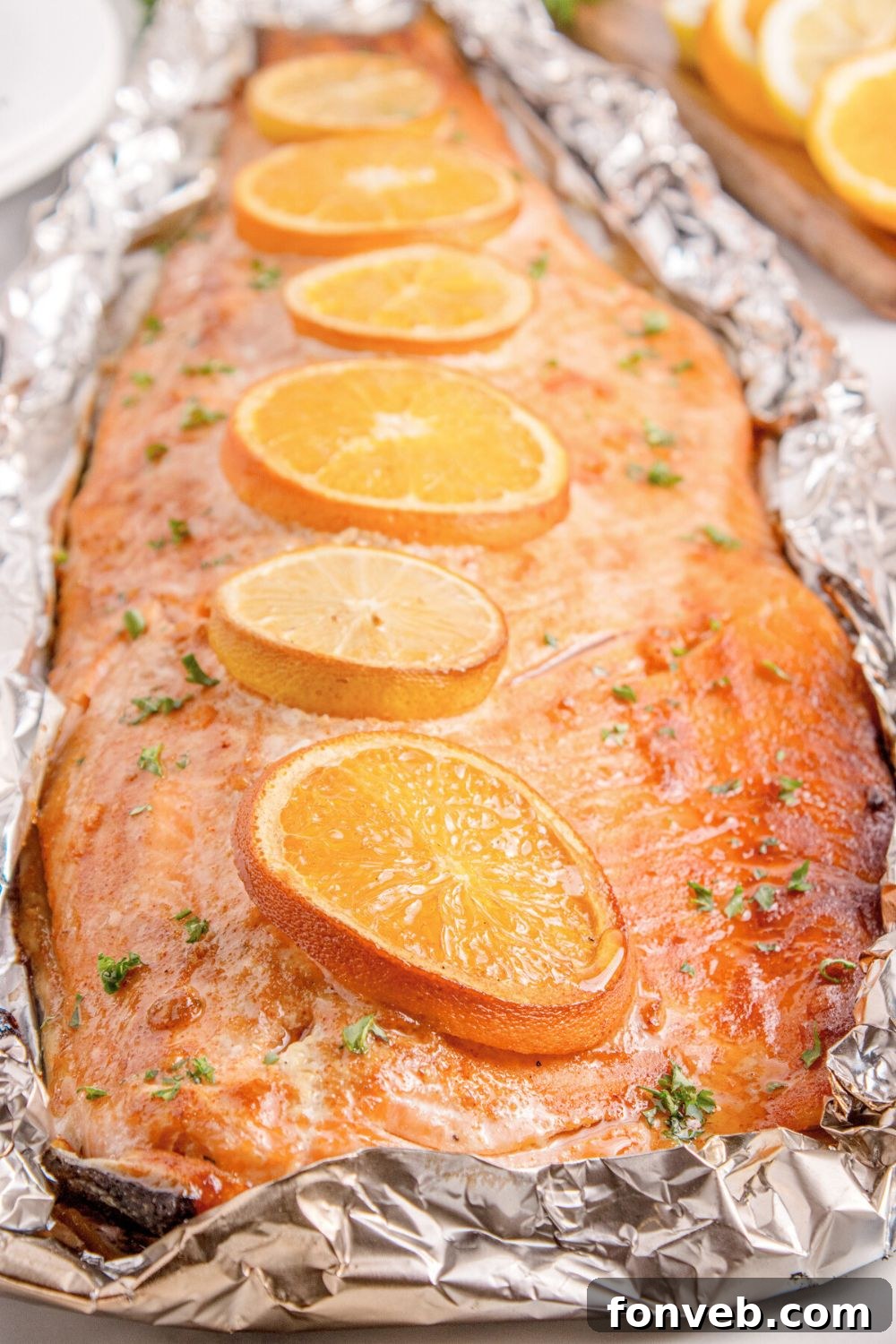 Effortless Honey Mustard Salmon Foil Grill 4 Grilled Honey Mustard Salmon in Foil sitting on table with oranges to side of table