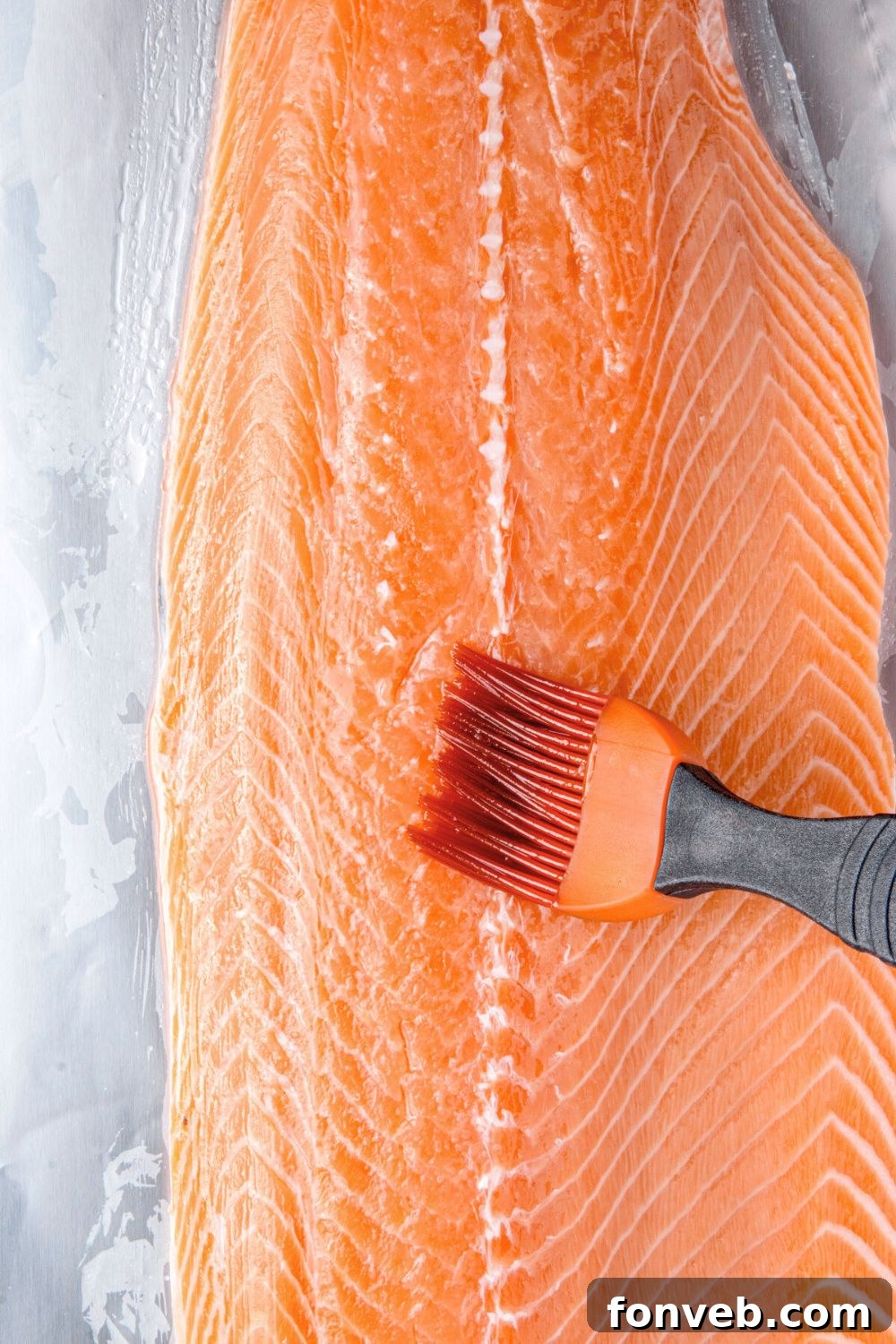 Effortless Honey Mustard Salmon Foil Grill 8 brushing salmon fillet with oil