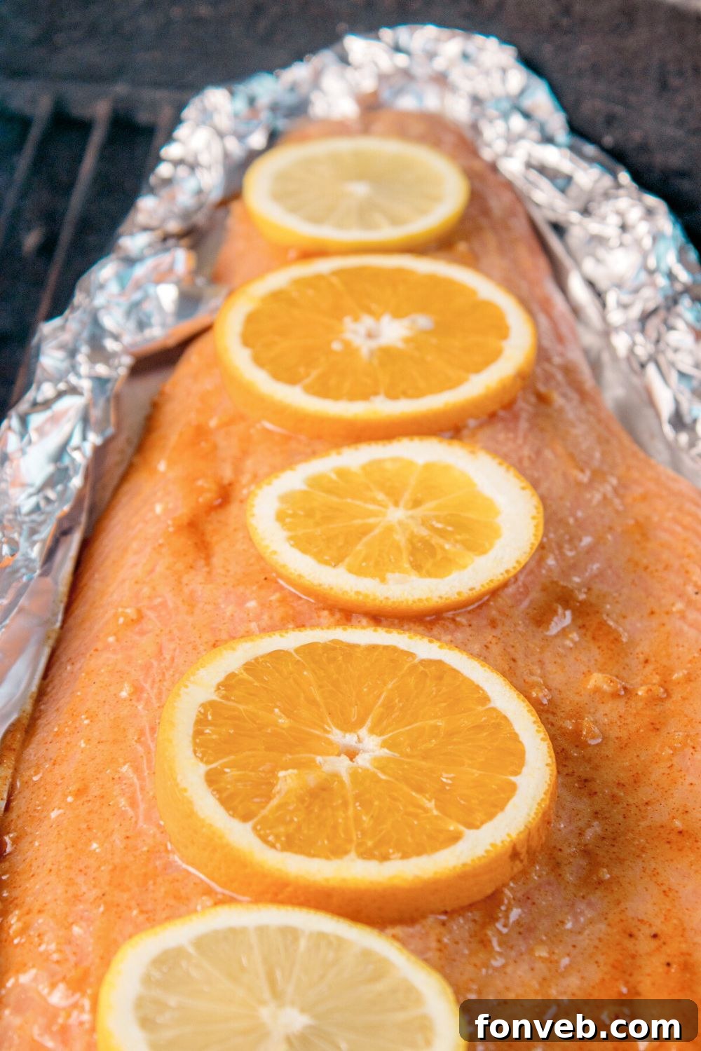 Effortless Honey Mustard Salmon Foil Grill 10 close up of Grilled Honey Mustard Salmon in Foil on the grill