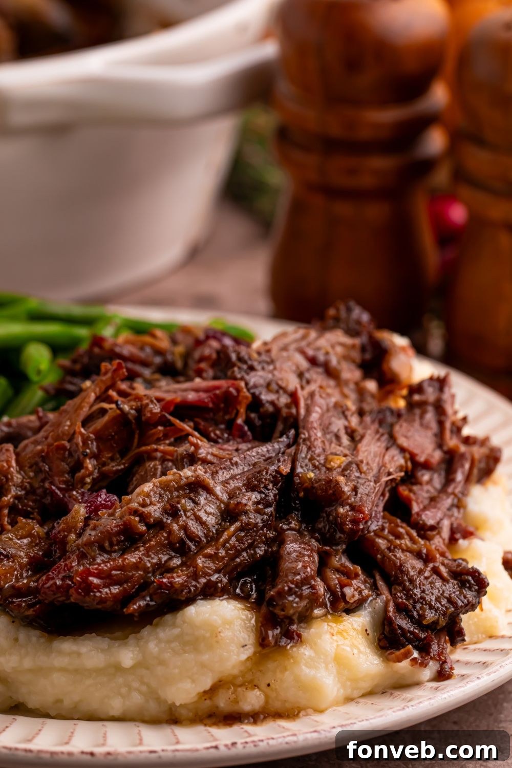 Cranberry Pot Roast on plate with mashed potatoes under it 