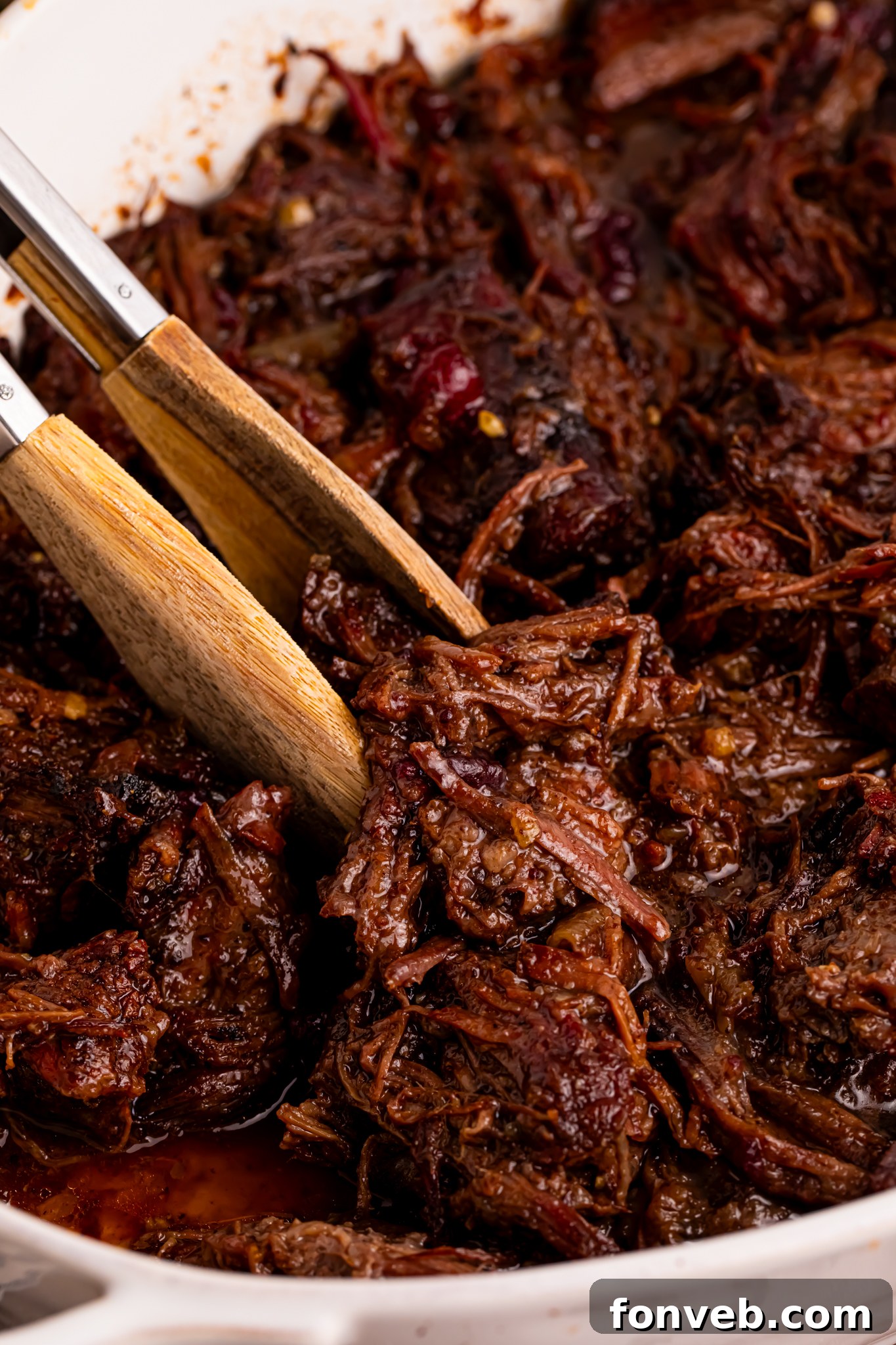 Cranberry Pot Roast shredded in a baking dish 