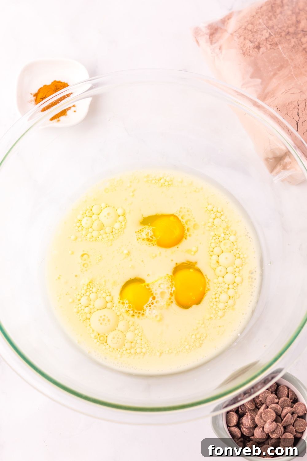 wet batter in a glass bowl for making Costco Double Chocolate Muffins