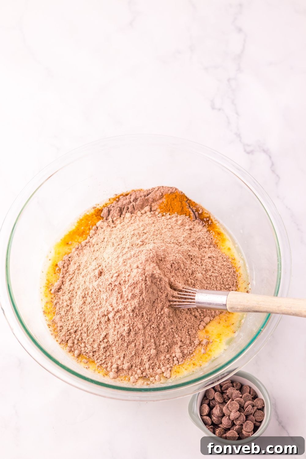 chocolate cake mix poured into a bowl for making Costco Double Chocolate Muffins