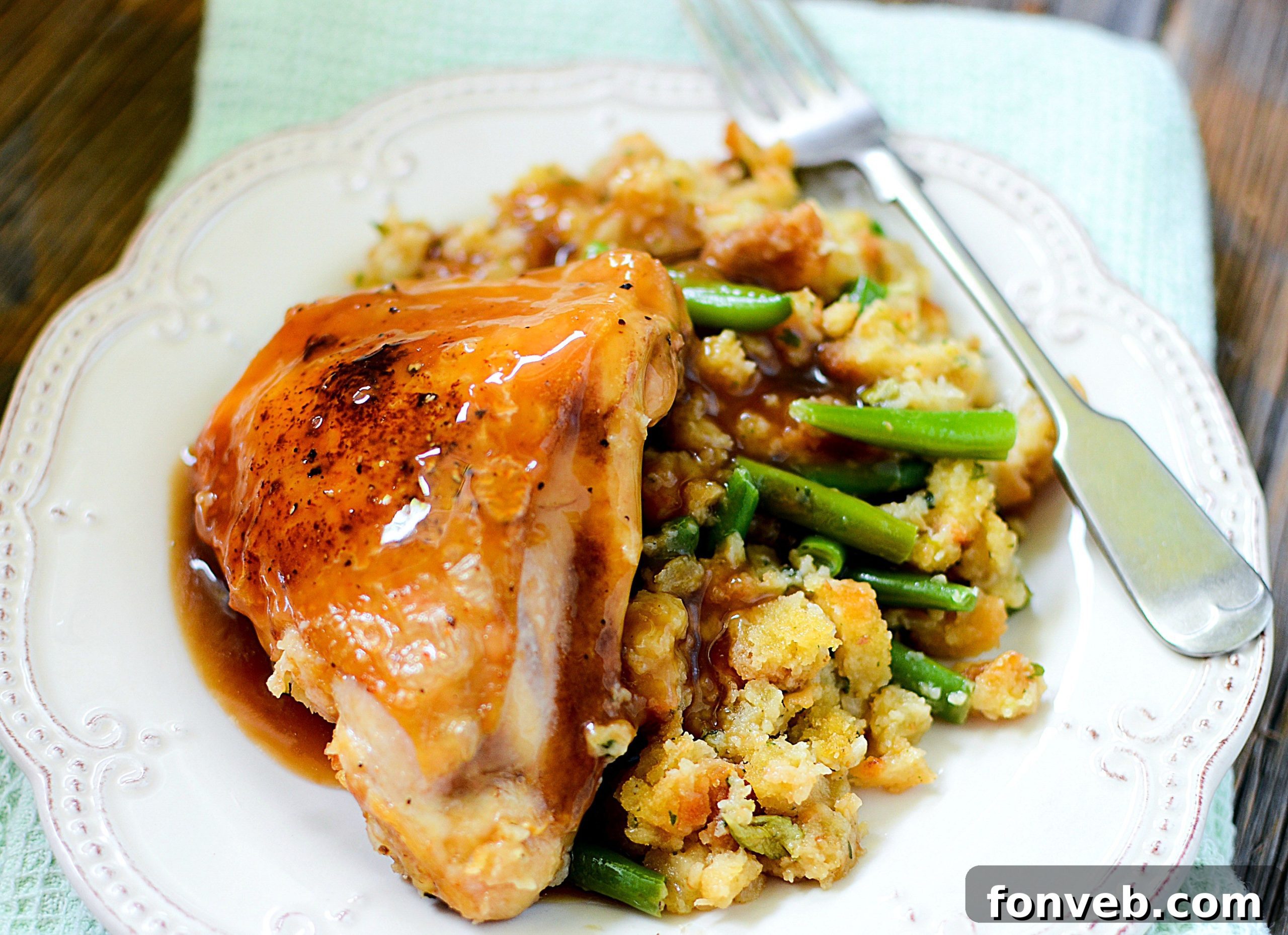 Close-up of the cooked garlic chicken and stuffing with tender green beans, ready to serve
