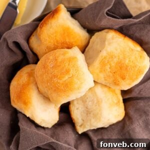2 Ingredient Dinner Rolls in a basket with a towel inside of it