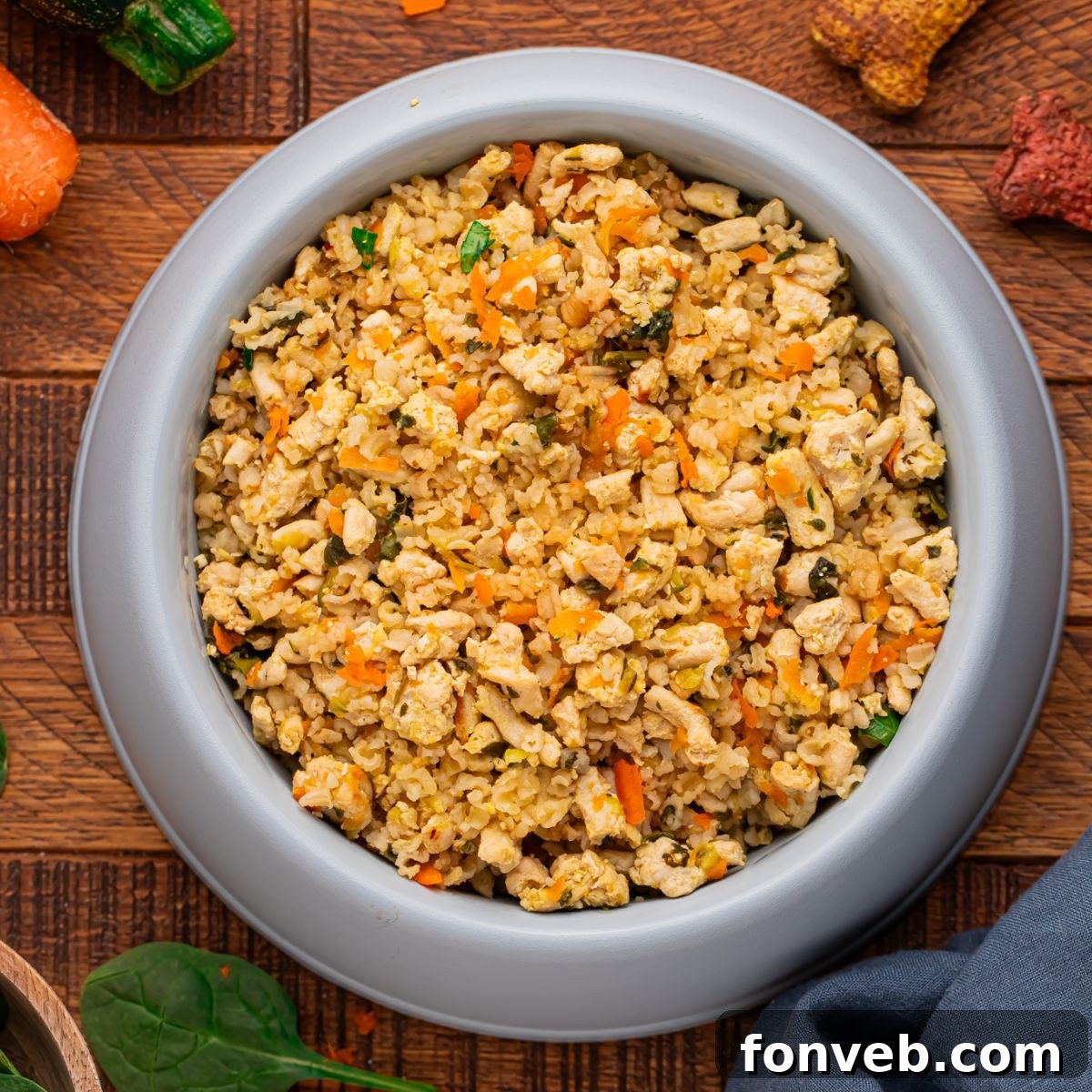 Homemade Turkey and Rice Dog Food with Veggies in a dog food bowl on table 