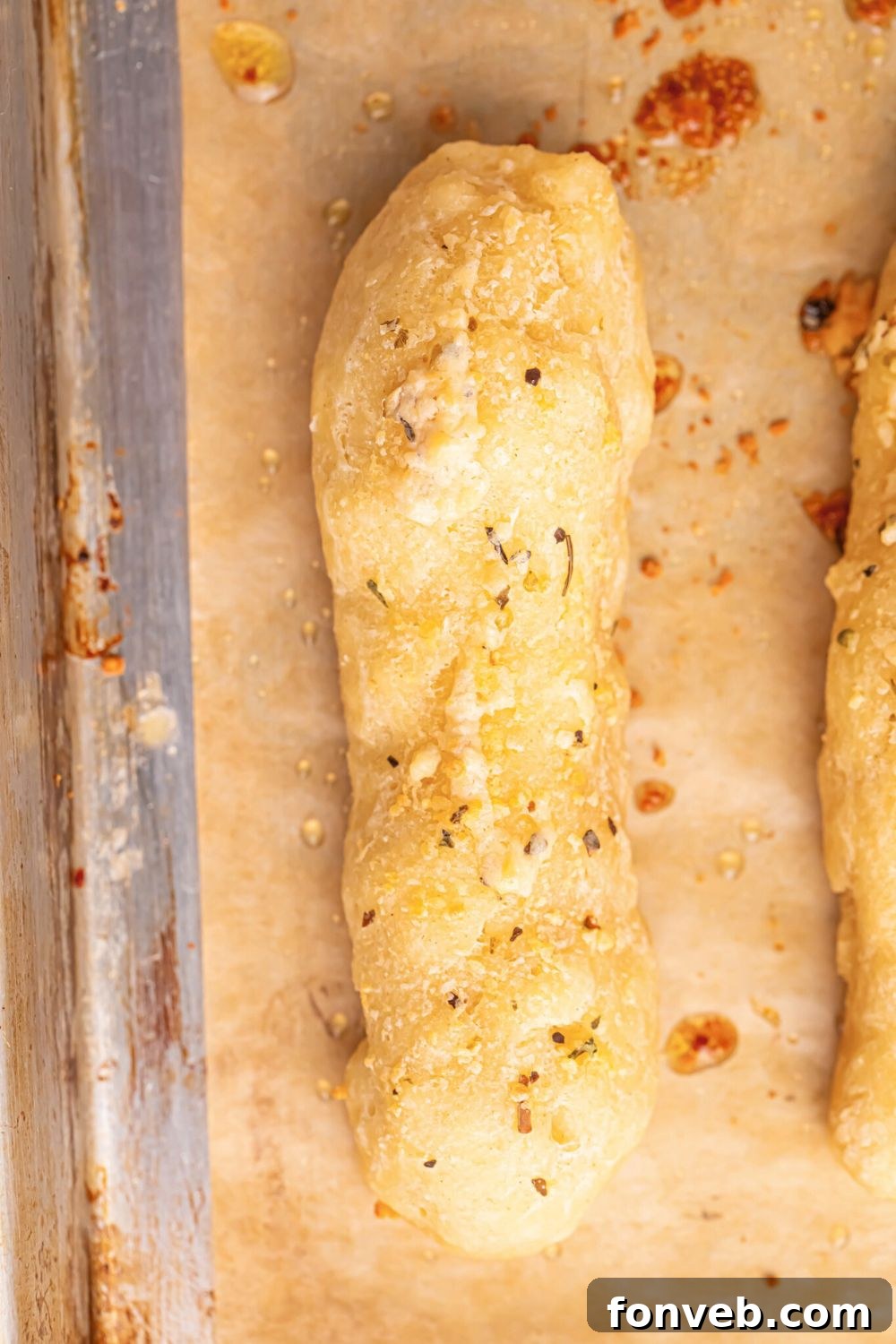 2-Ingredient Buttery Garlic Parmesan Breadsticks 12 2 Ingredient Garlic Parmesan Breadstick on table