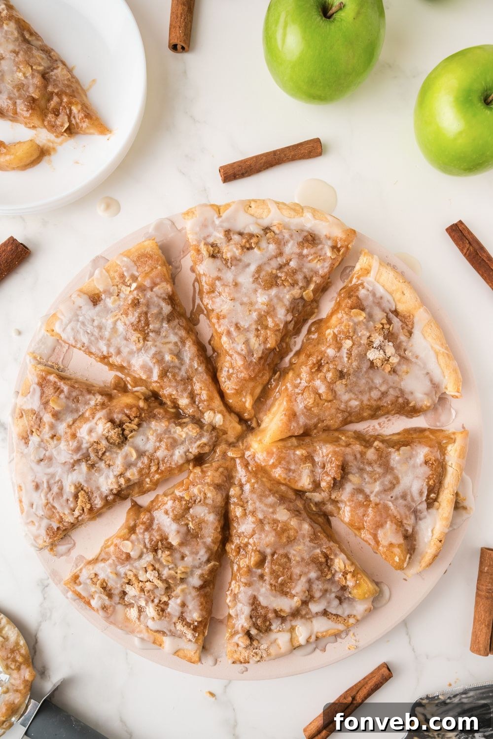 Apple Pie Pizza presented beautifully on a wooden table, adorned with cinnamon sticks and fresh apples, evoking a delightful autumn ambiance.
