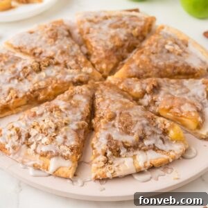 close up view of Easy Apple Pie Pizza cut and placed in a circle and on table