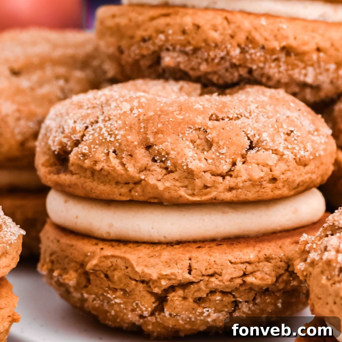 Pillowy Soft Spiced Apple Cider Whoopie Pies 3 Apple Cider Whoopie Pies stacked on tables