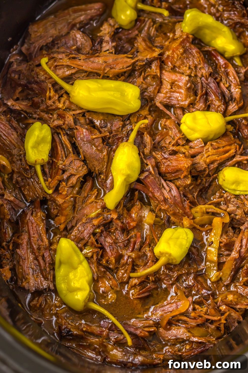 Deliciously Simple Slow Cooker Mississippi Pot Roast Sliders 17 close up of Slow Cooker with Mississippi Pot Roast inside