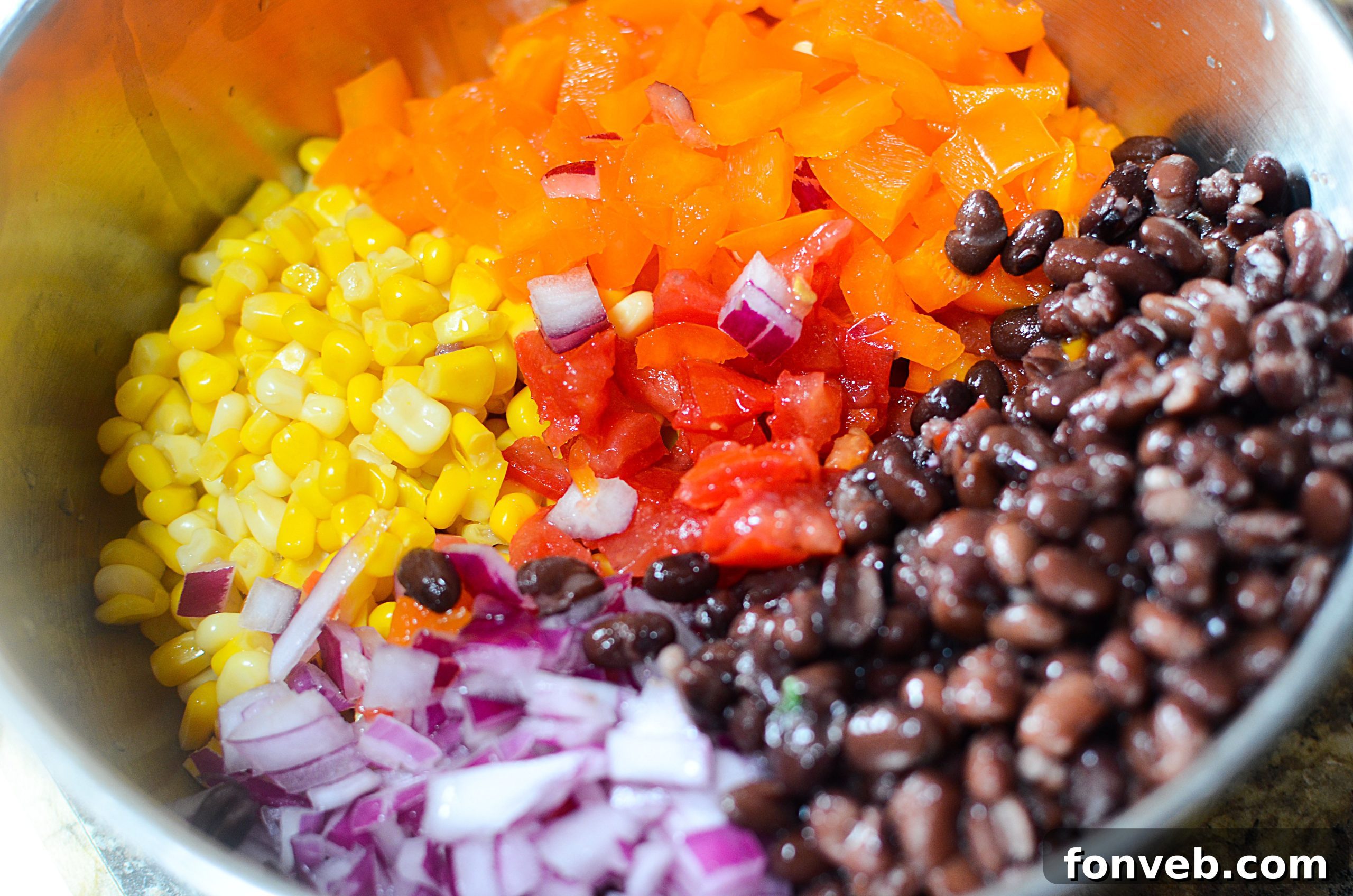 Close-up of Cowboy Caviar with tortilla chips, highlighting fresh ingredients