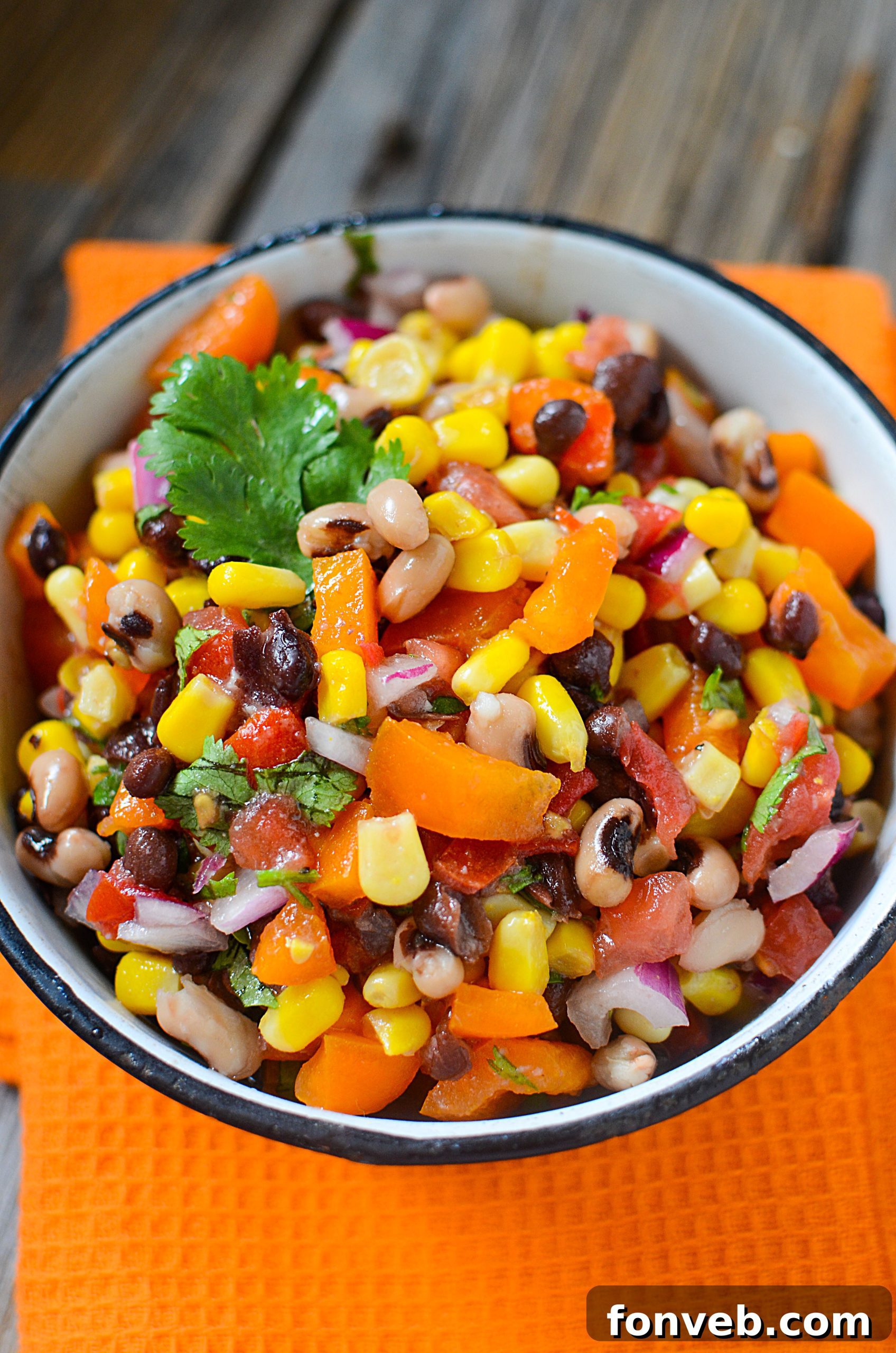 Large bowl of Cowboy Caviar on a rustic table, ready for a gathering