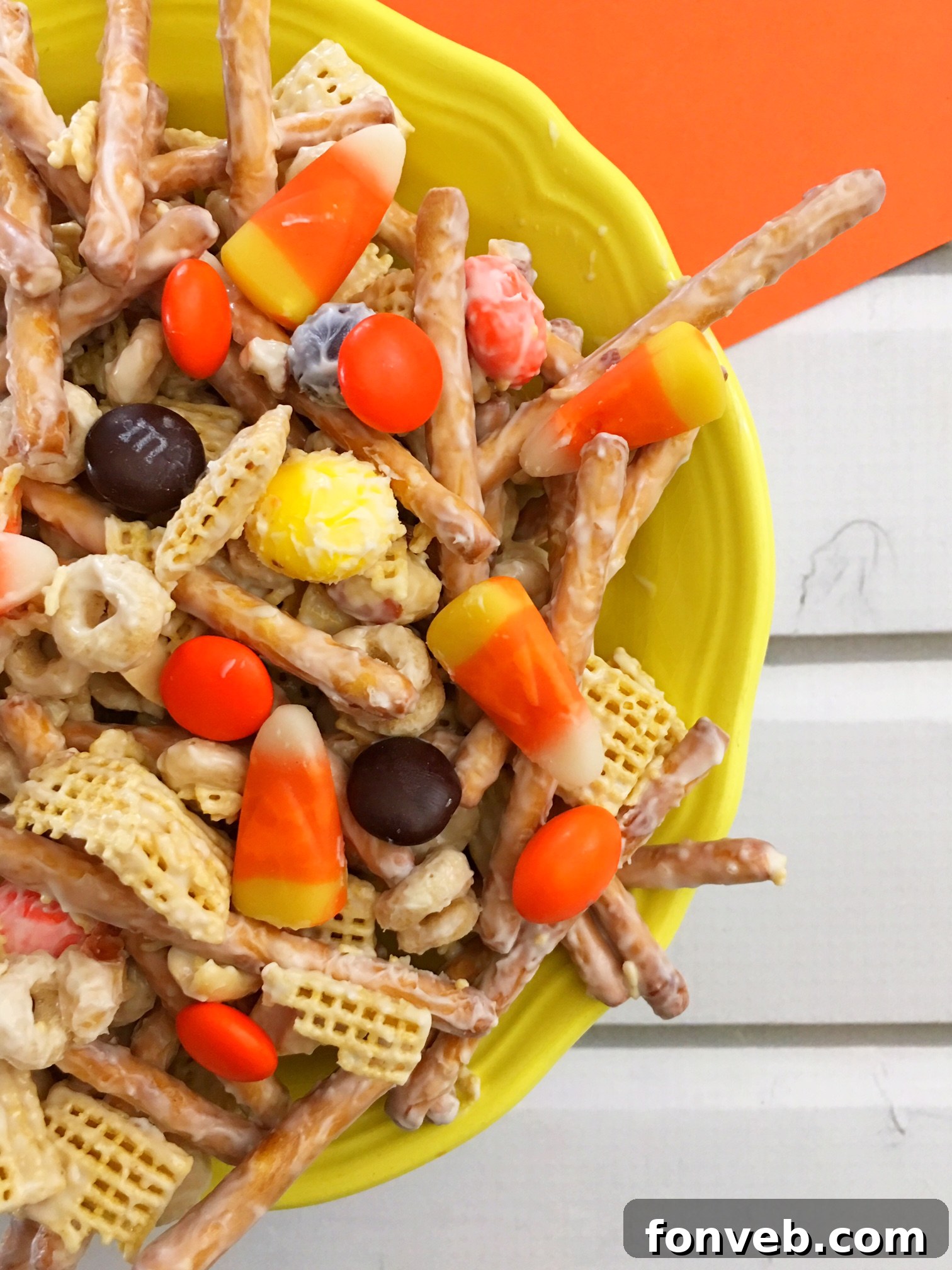 A festive pile of Fall Harvest Crack with M&Ms and candy corn visible, ready for a Halloween celebration.
