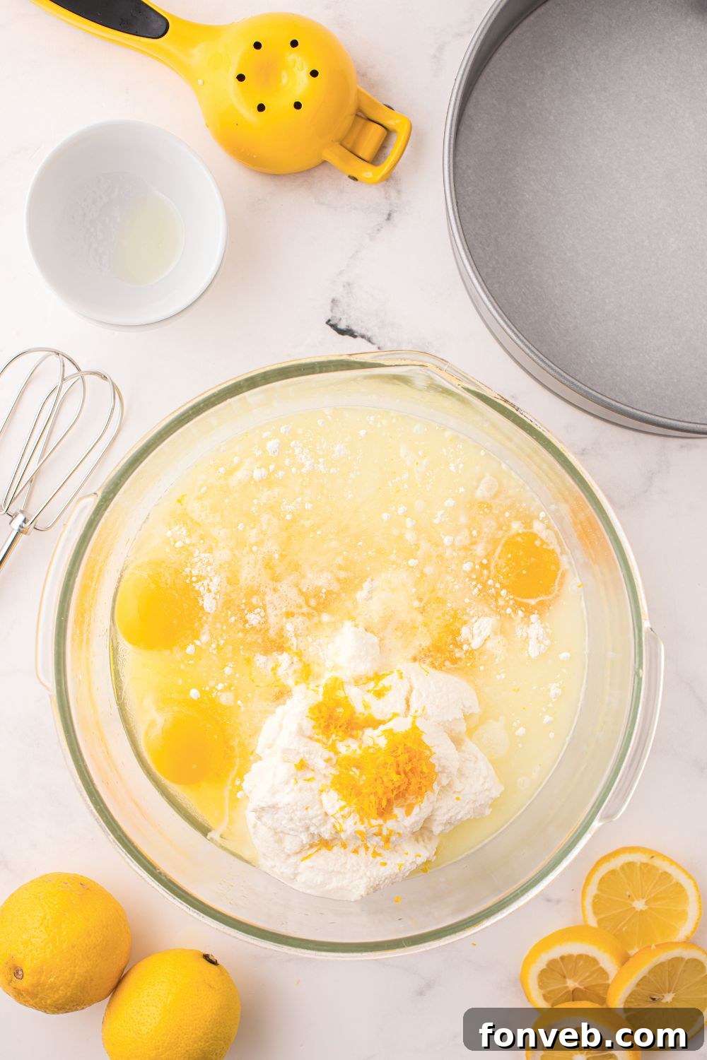 Lemon Ricotta Cake ingredients in a glass bowl on table