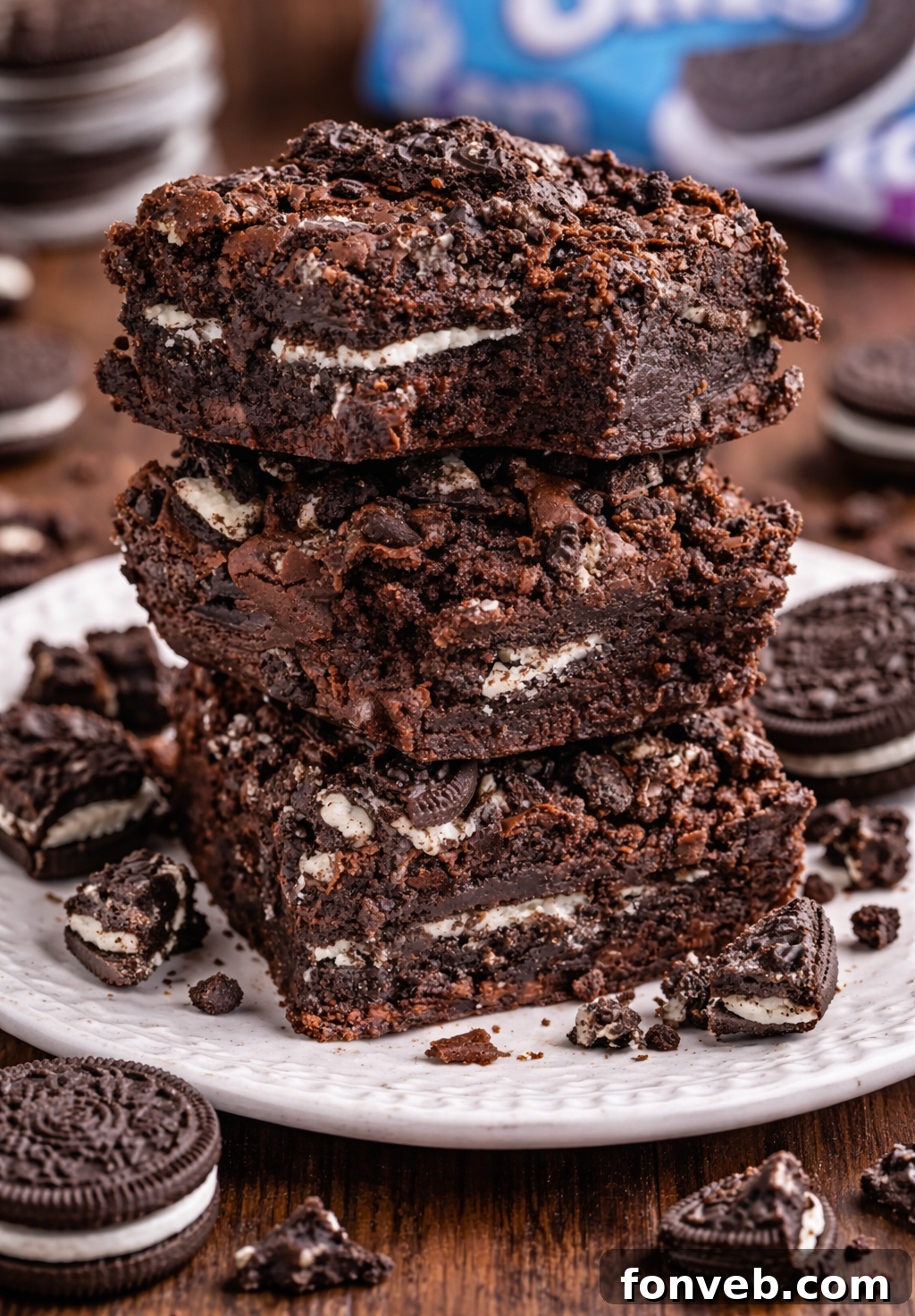 Decadent Oreo Stuffed Fudgy Brownies 2 Oreo Stuffed Brownies stacked on top of one another on table