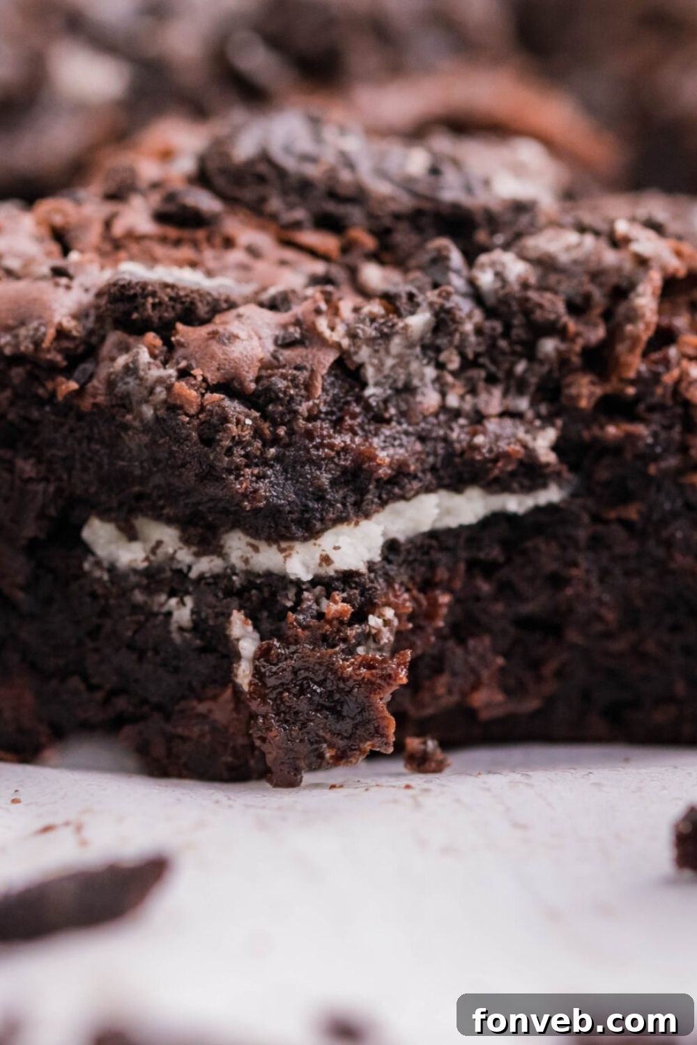 Decadent Oreo Stuffed Fudgy Brownies 6 close up of Oreo Stuffed Brownies placed on a table