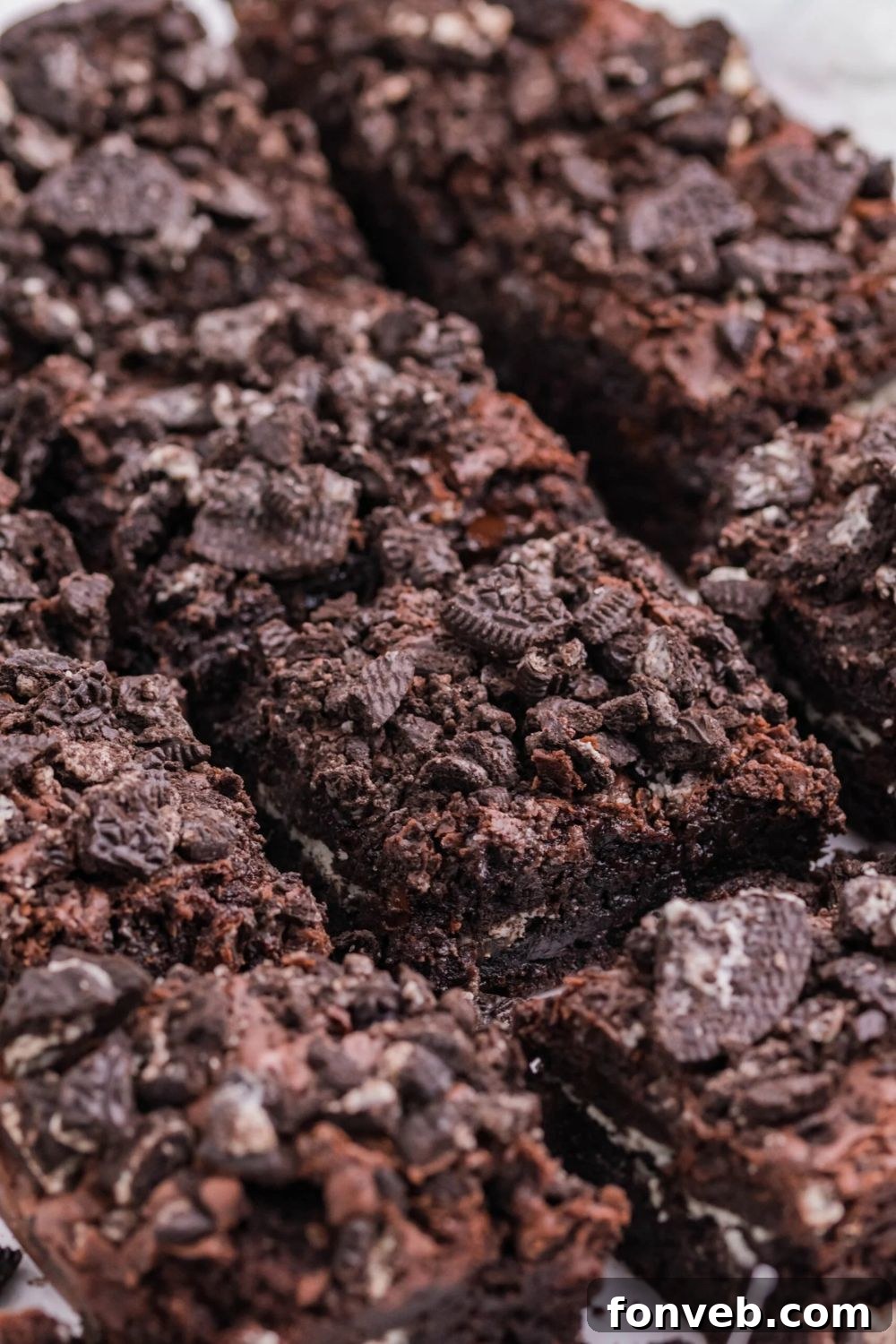 Decadent Oreo Stuffed Fudgy Brownies 8 sliced Oreo Stuffed Brownies cut and placed on table