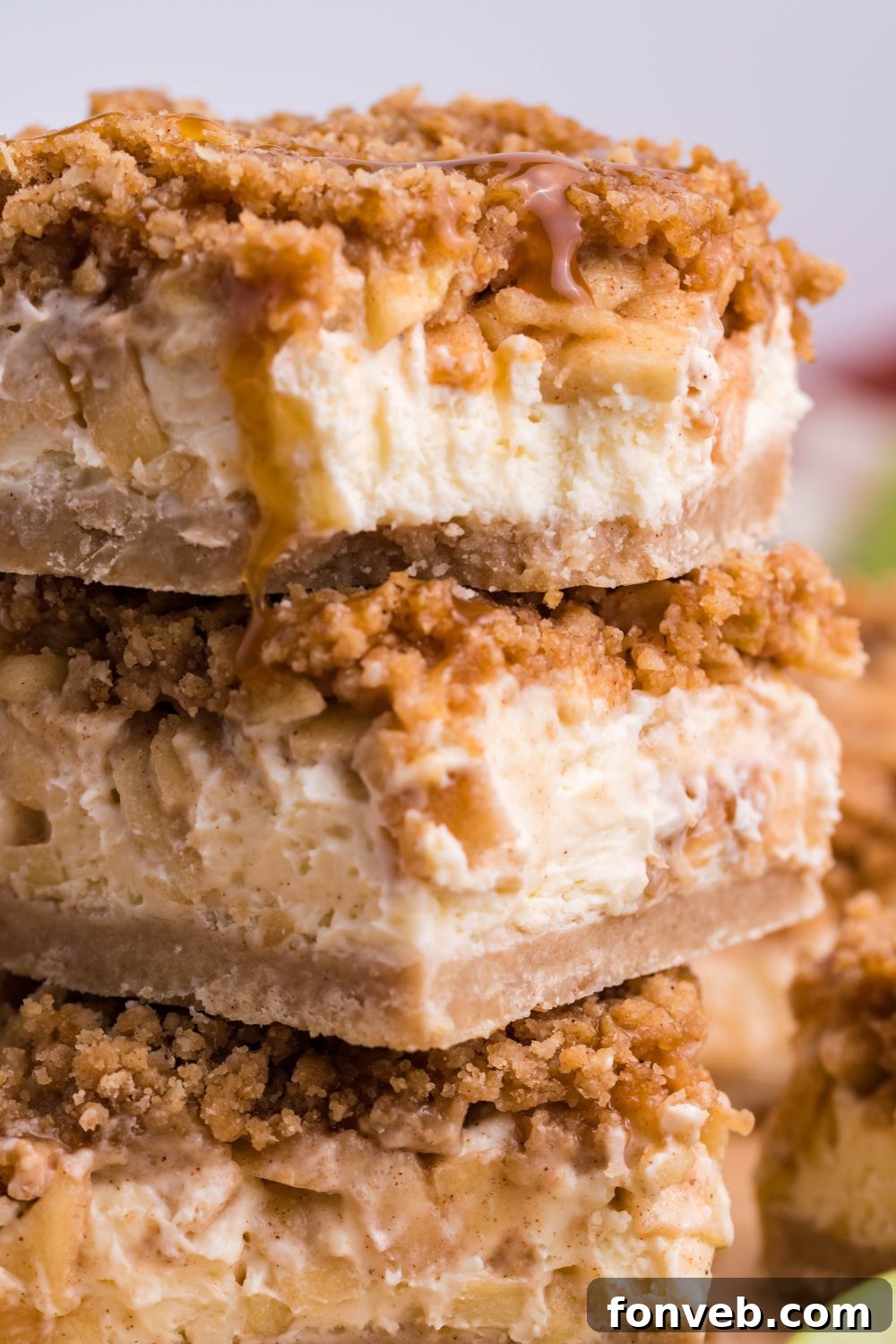 stack of Caramel Apple Cheesecake Bars on table 