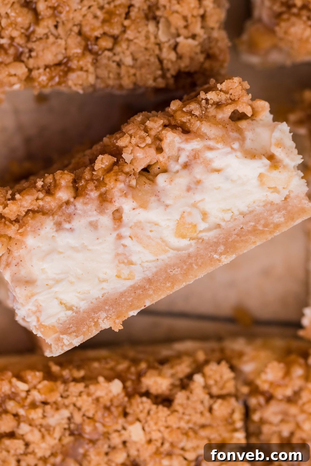 Caramel Apple Cheesecake Bar on its side on table with more placed around it on table 