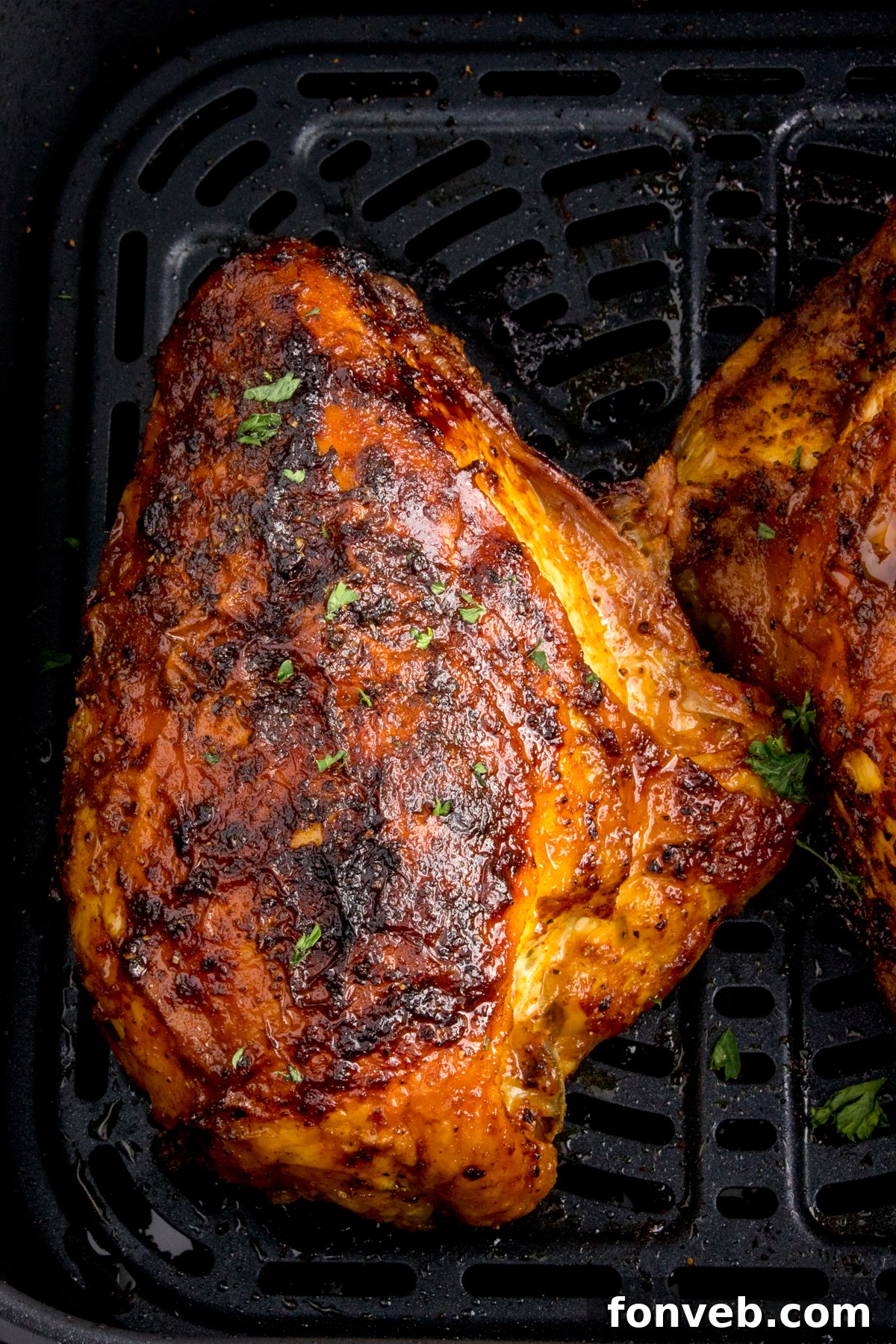 cooked Air Fryer Chicken Breast inside the air fryer basket 