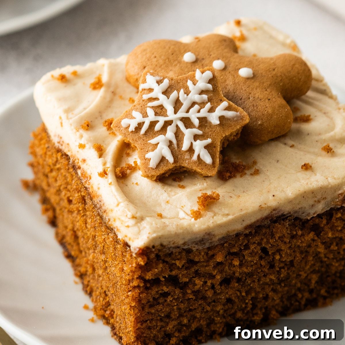 slice of Gingerbread Cake with Cream Cheese Frosting on plate
