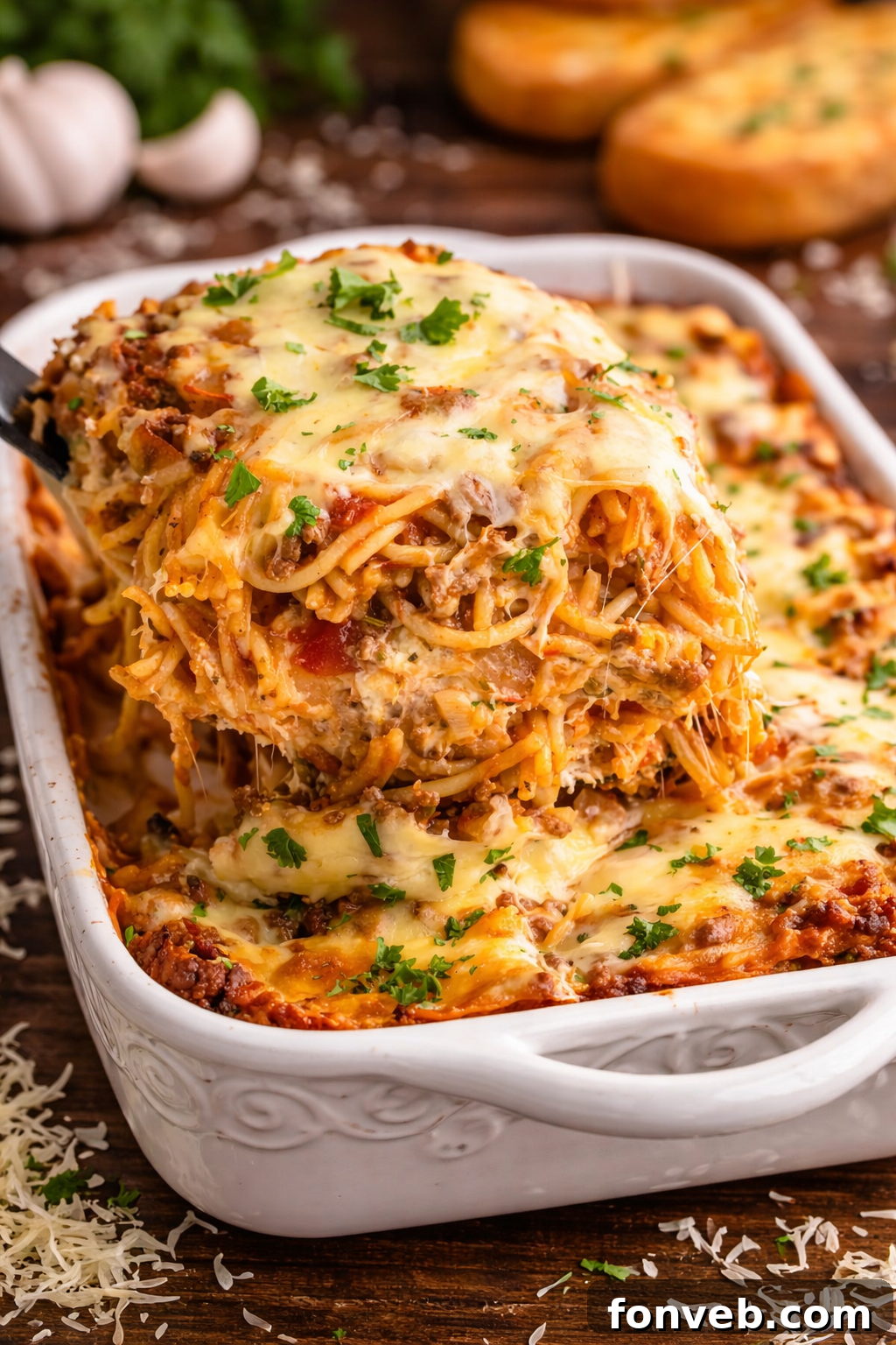 Million Dollar Spaghetti Casserole in a white baking dish, fresh from the oven and golden brown