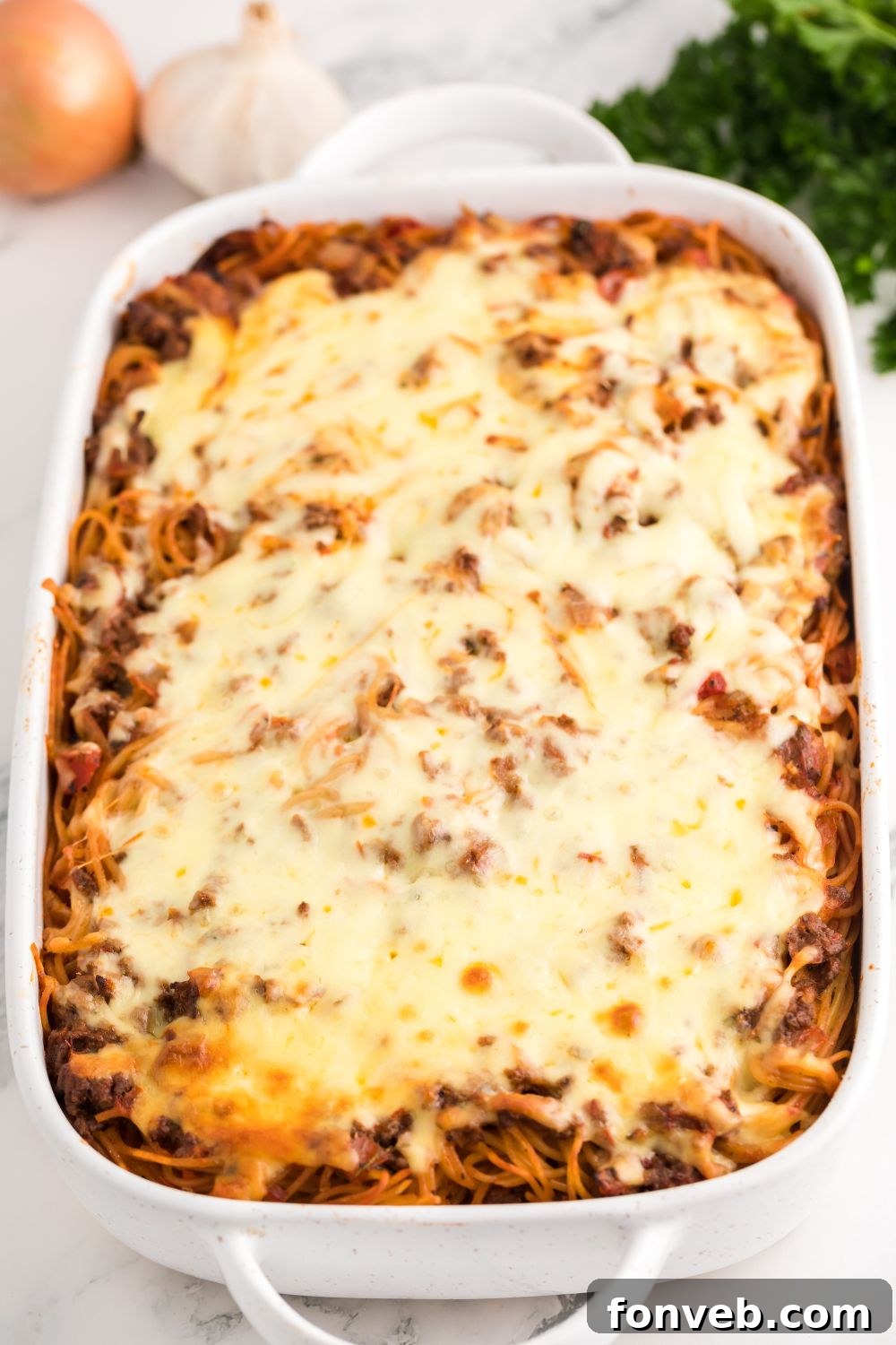 Baked Million Dollar Spaghetti Casserole, bubbly and golden, straight from the oven, showcasing a perfectly melted cheese crust