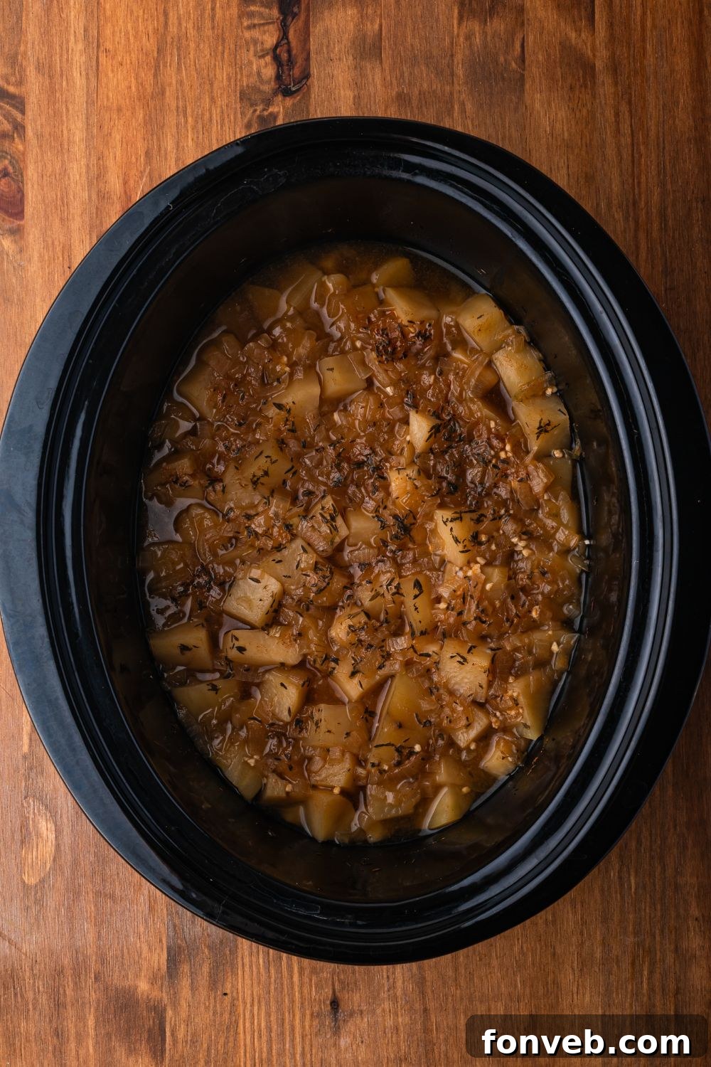 black crockpot with cooked Crockpot Loaded Baked Potato Soup