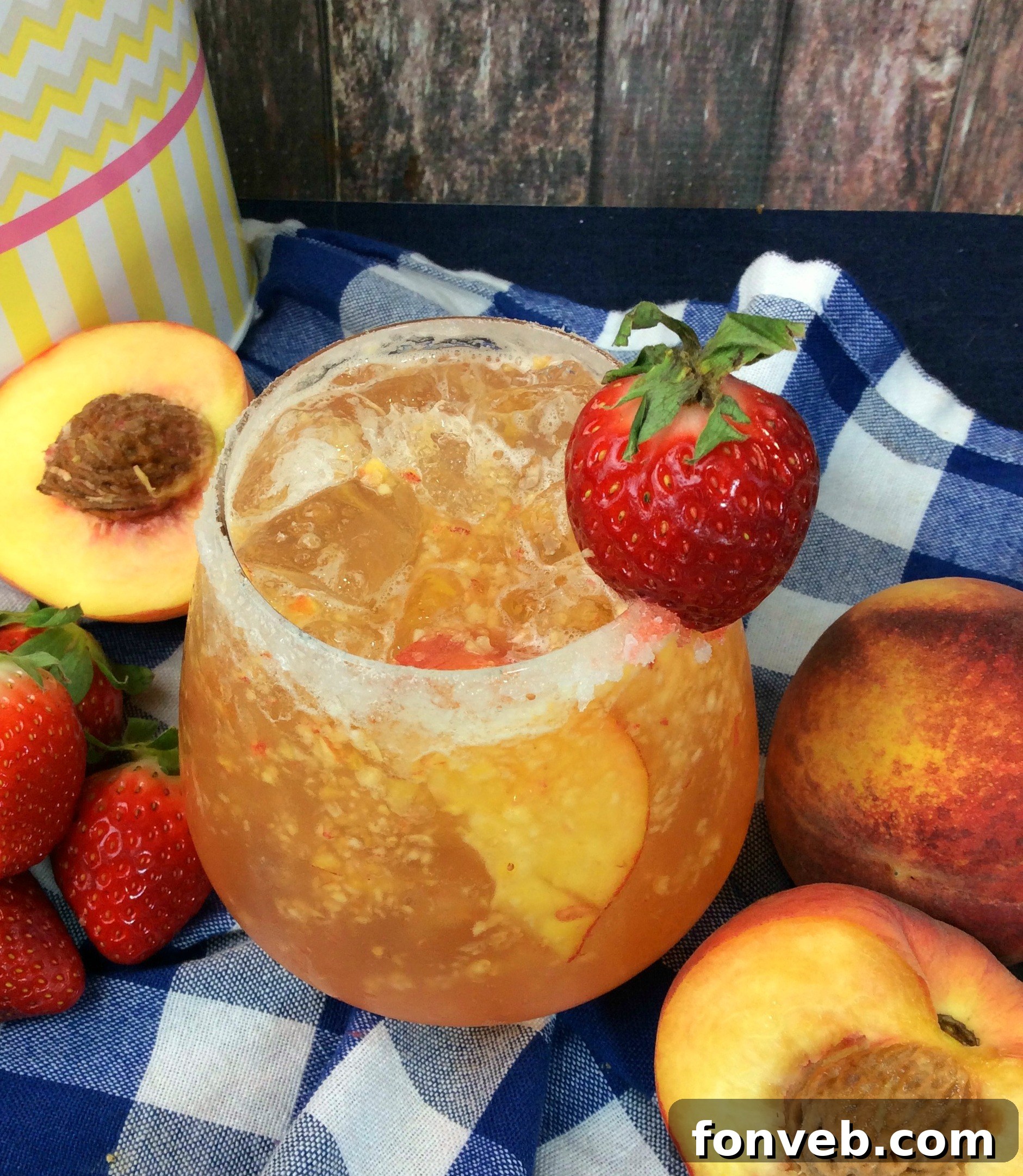 The Georgia Peach Flirt 5 Ingredients for a peach cocktail laid out, including fresh peaches and spirits.