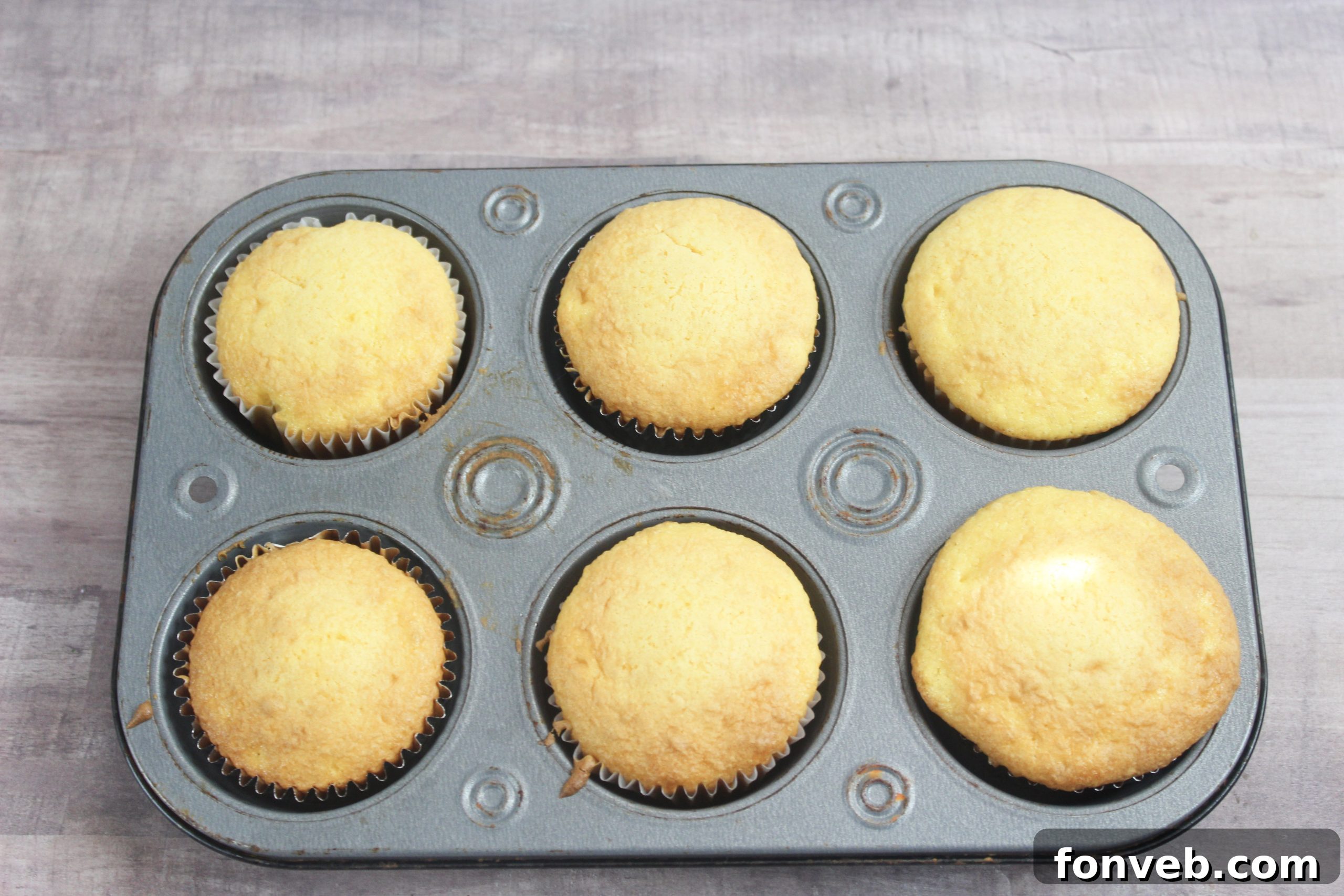 Wicked Witch Hat Cupcakes 3 Close-up of freshly decorated Halloween witch hat cupcakes ready for a party.