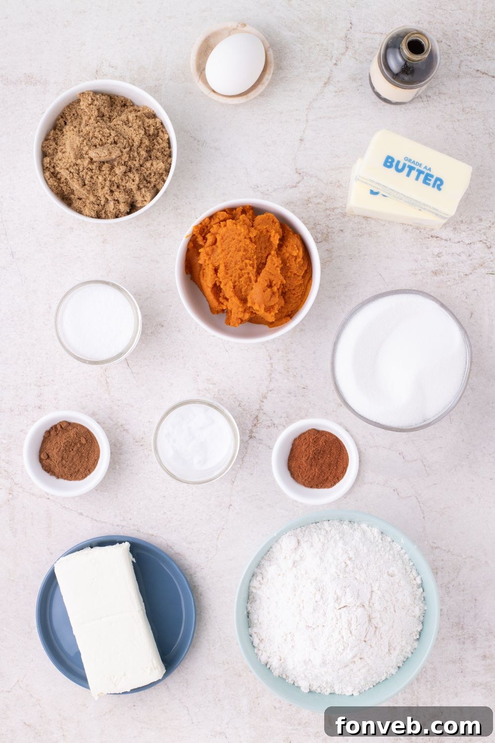 all the ingredients for Pumpkin Cheesecake Cookies on table in single serve bowls